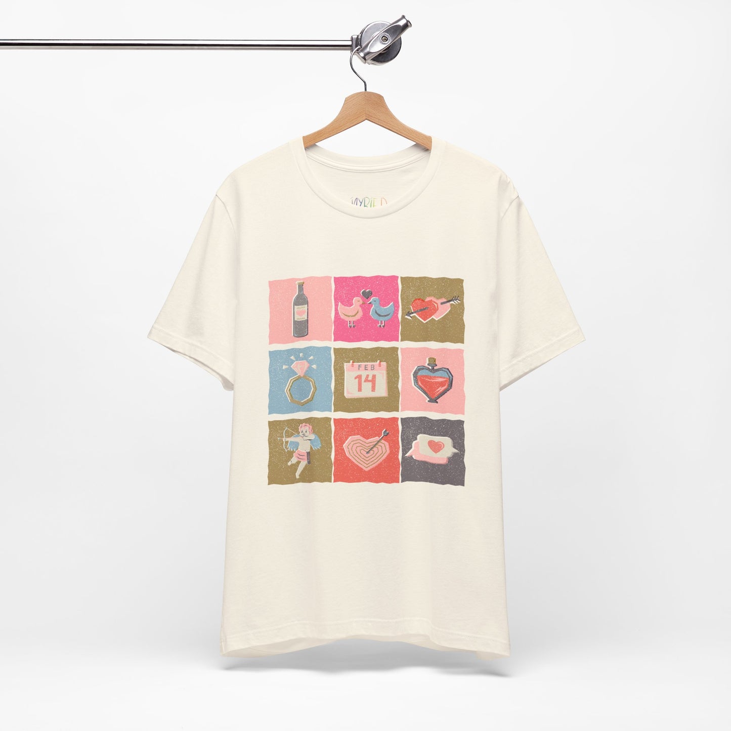 Beige t-shirt with colorful graphic design of Valentine's Day images stacked in blocks