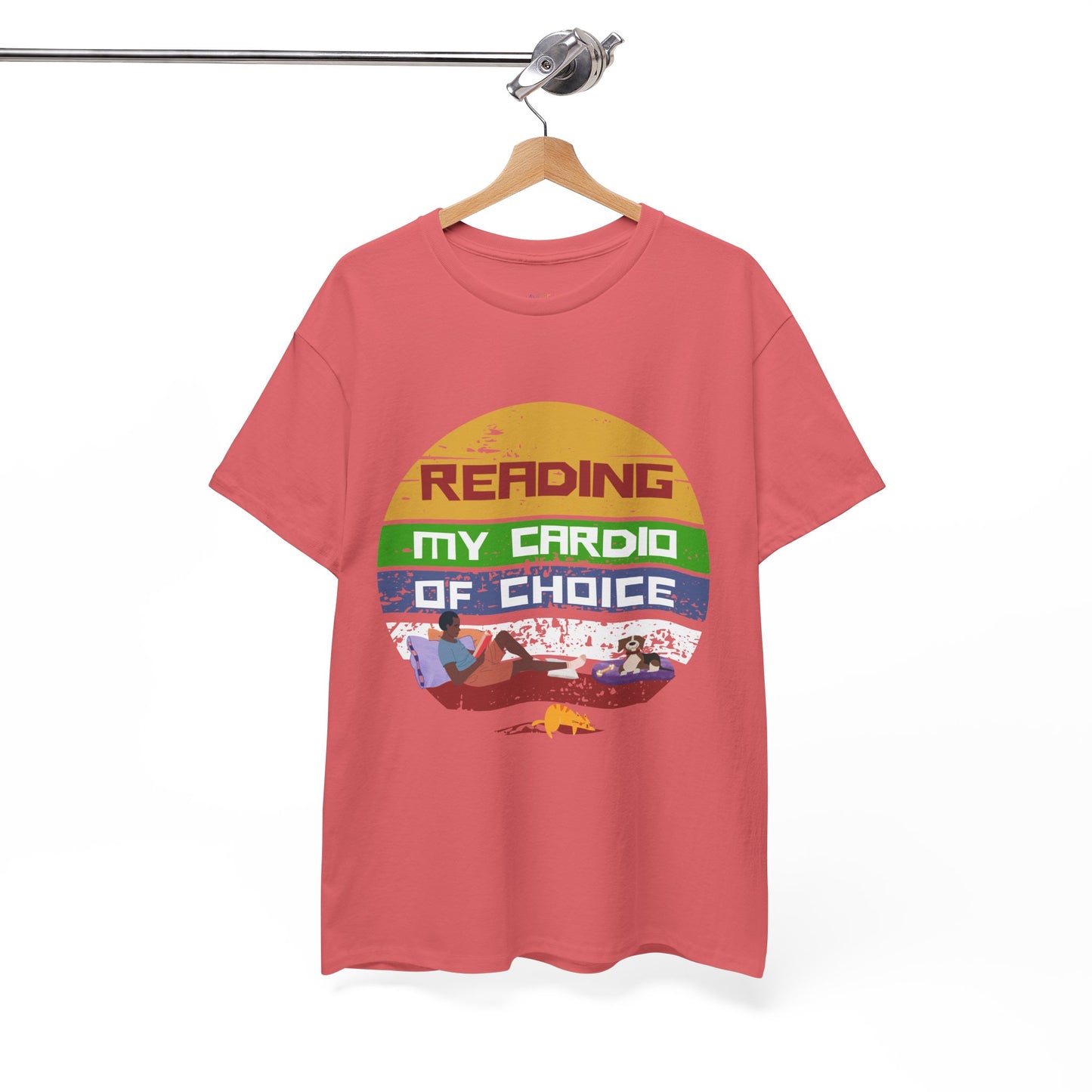 Pink retro t-shirt with a colorful striped circle featuring a man reading a book alongside his dog and cat, and text 'Reading, My Cardio Of Choice' 