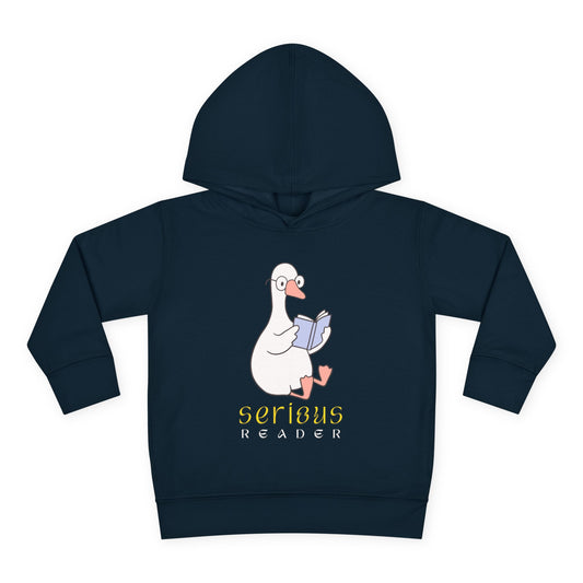 Two playful cartoon ducks — one holding a snack and the other perched on a stack of books — with the words “Came for Snacks • Stayed for the Books” above — printed on a toddler hoodie.