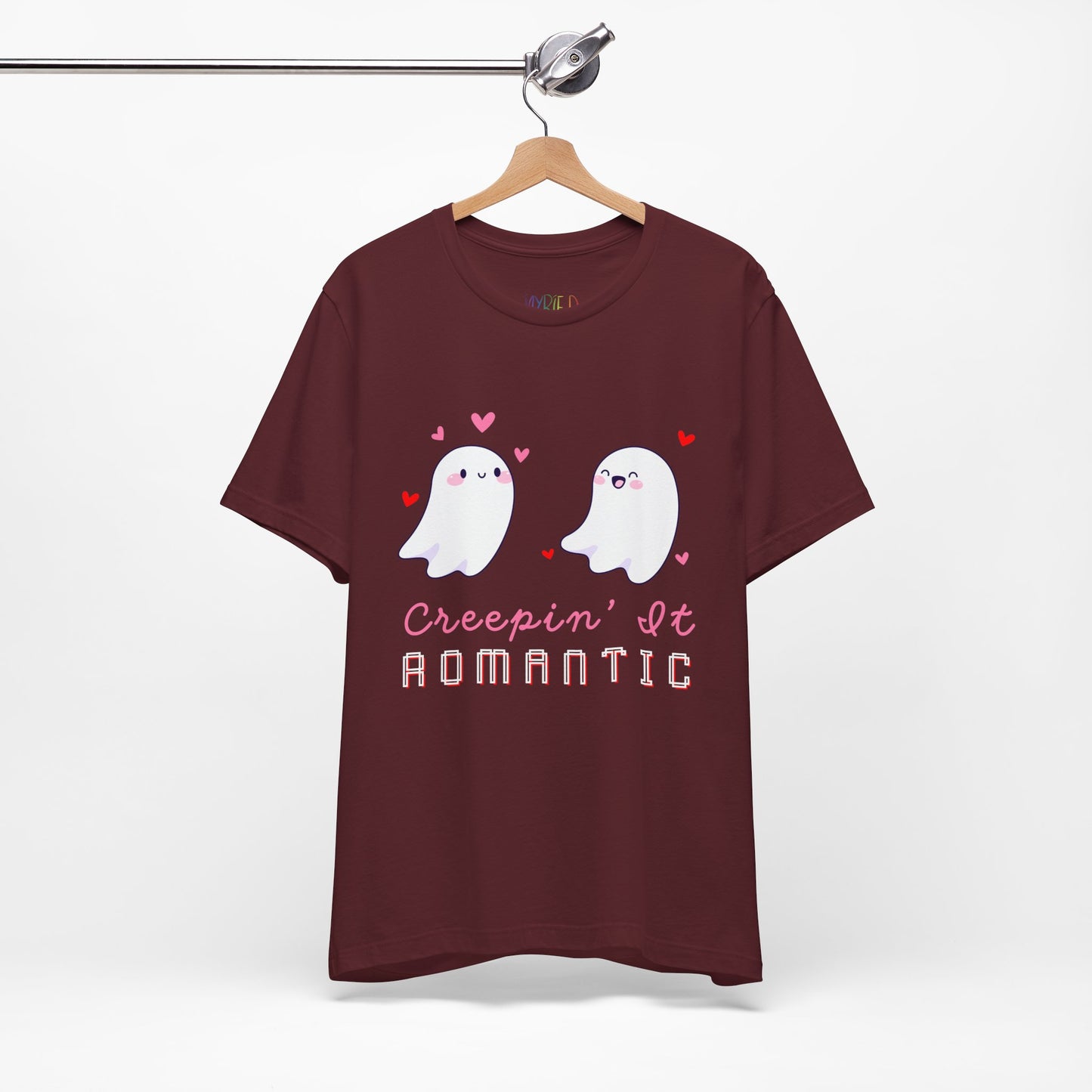 Maroon t-shirt with two flirty ghosts, scattered hearts and text 'Creepin' It Romantic' 