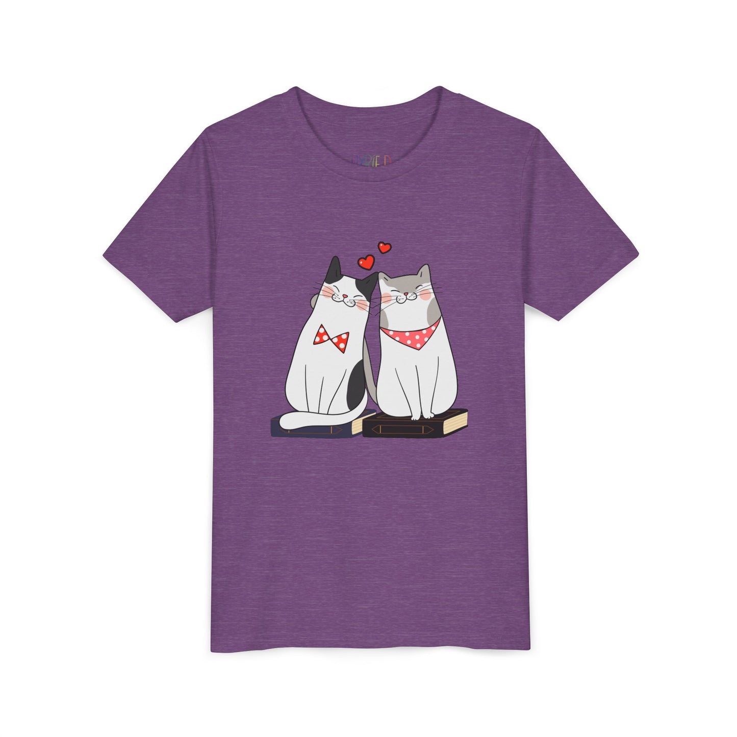 Light purple t-shirt with two cats snuggled up on books