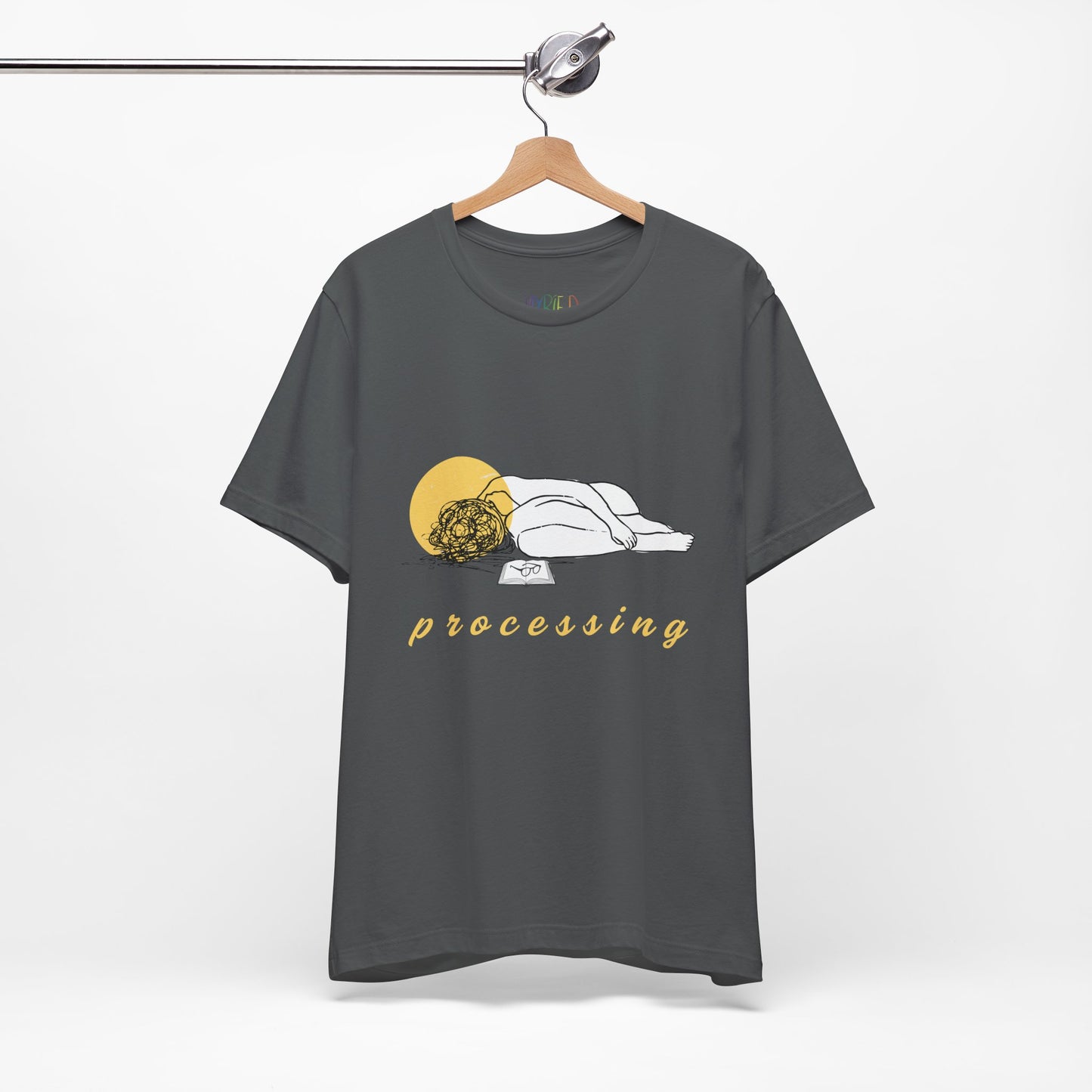 Gray t-shirt with person laying in a heap next to a book and 'processing' text 