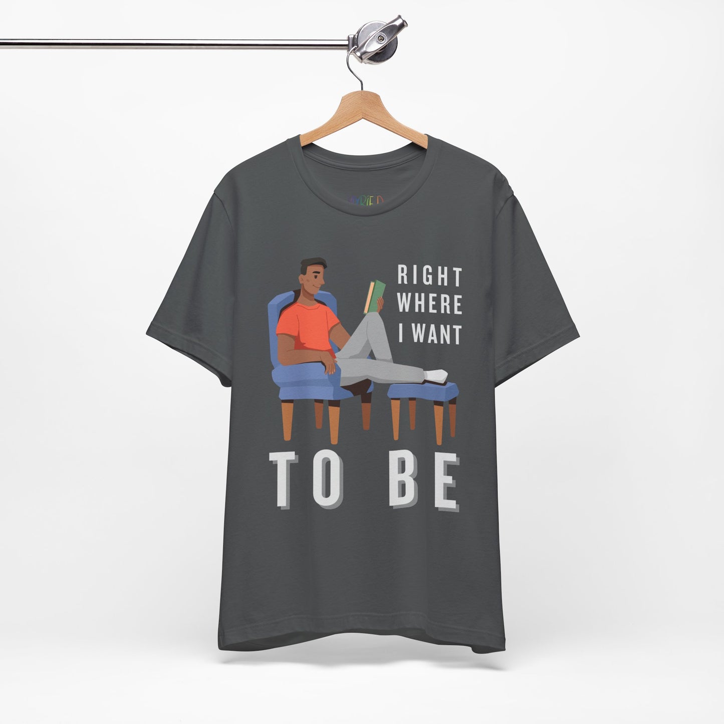 Gray t-shirt with a man lounging in a chair, feet up, book in hand and text 'Right Where I Want To Be'