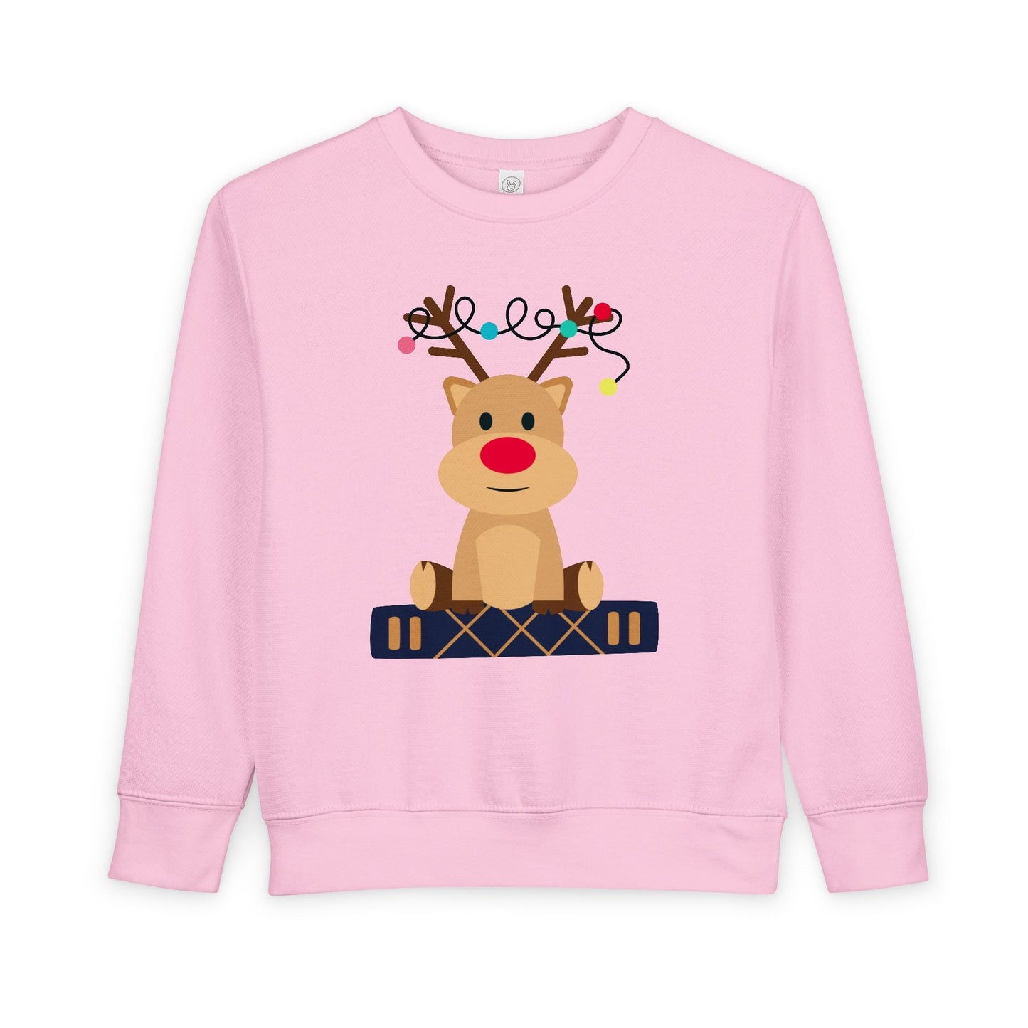 Pink toddler sweatshirt with a reindeer sitting on a book against a white background