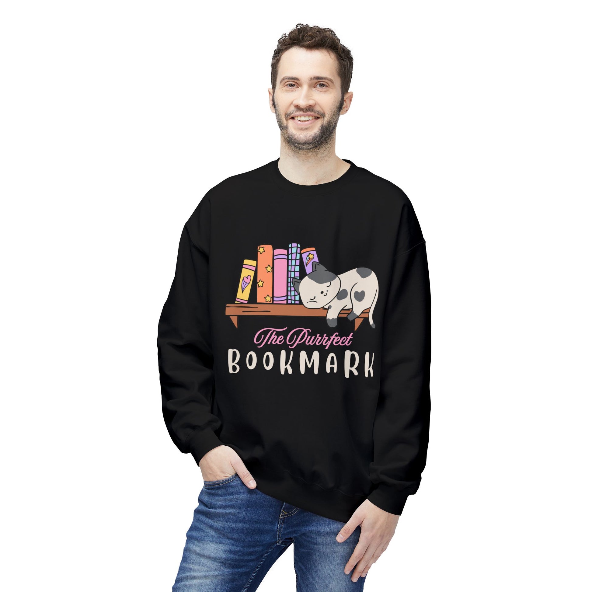 Man wearing a black sweatshirt with a cat sleeping on a bookshelf and 'The Purrfect Bookmark' text 