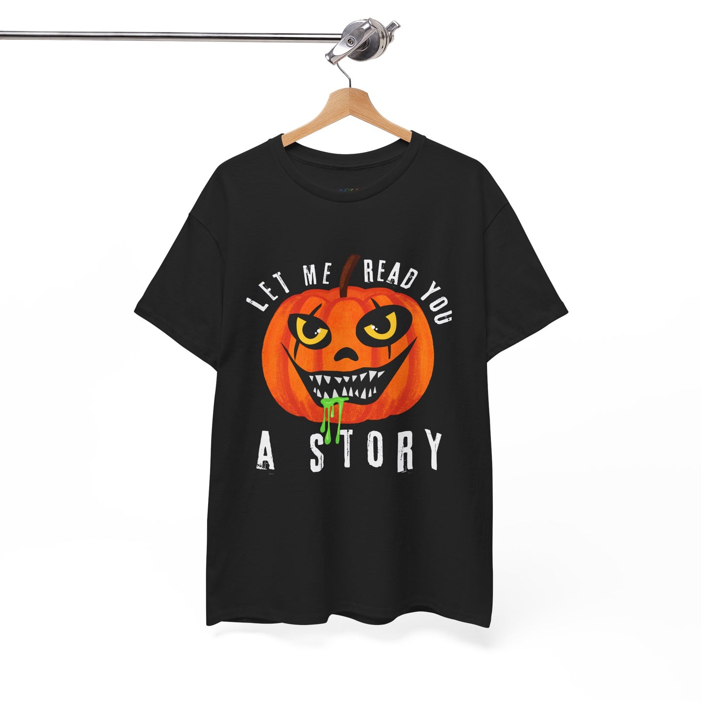 Black t-shirt with an evil pumpkin graphic and text 'Let Me Read You A Story' on a hanger against a white background
