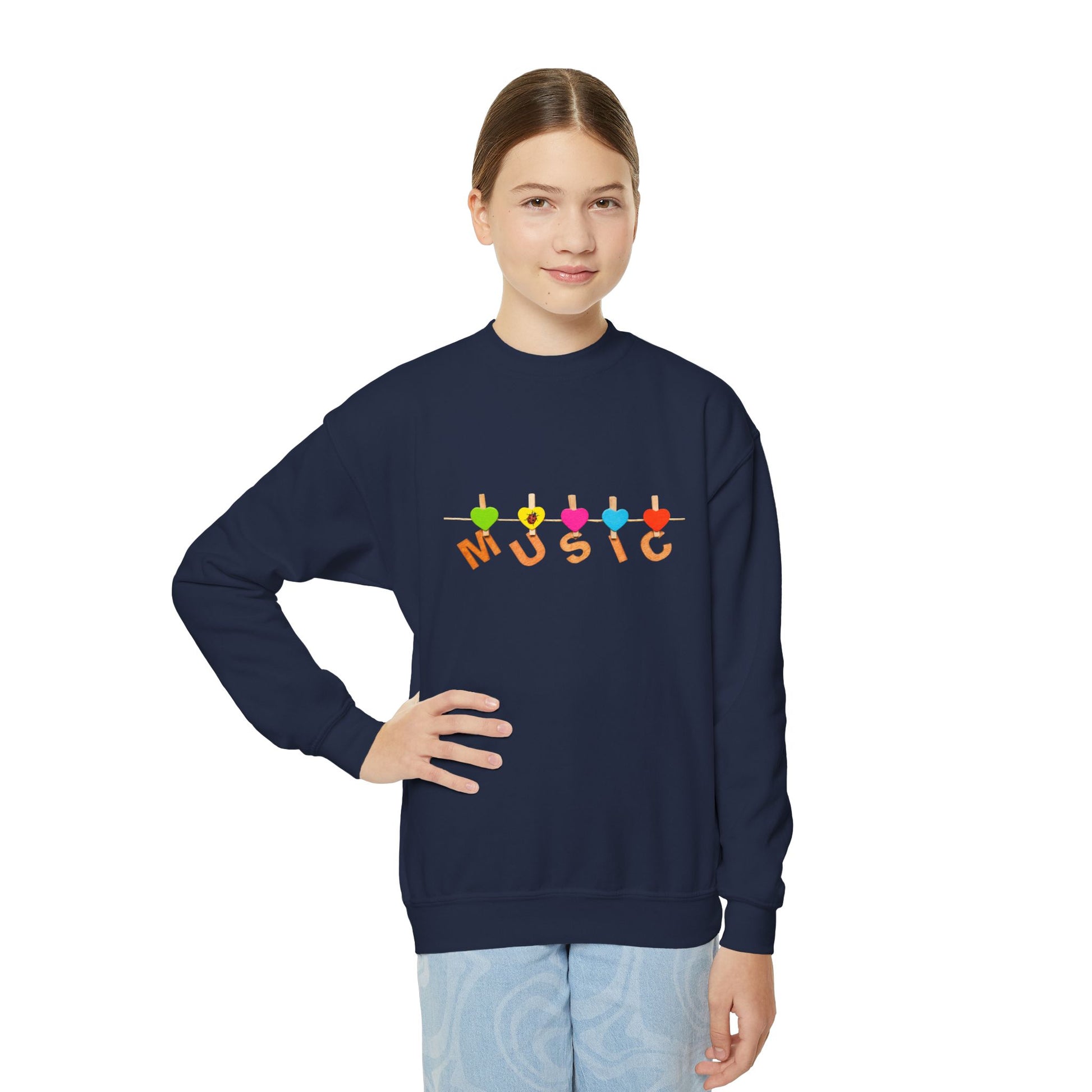 Girl wearing a navy blue sweatshirt with colorful heart clothesline clips and 'MUSIC' text