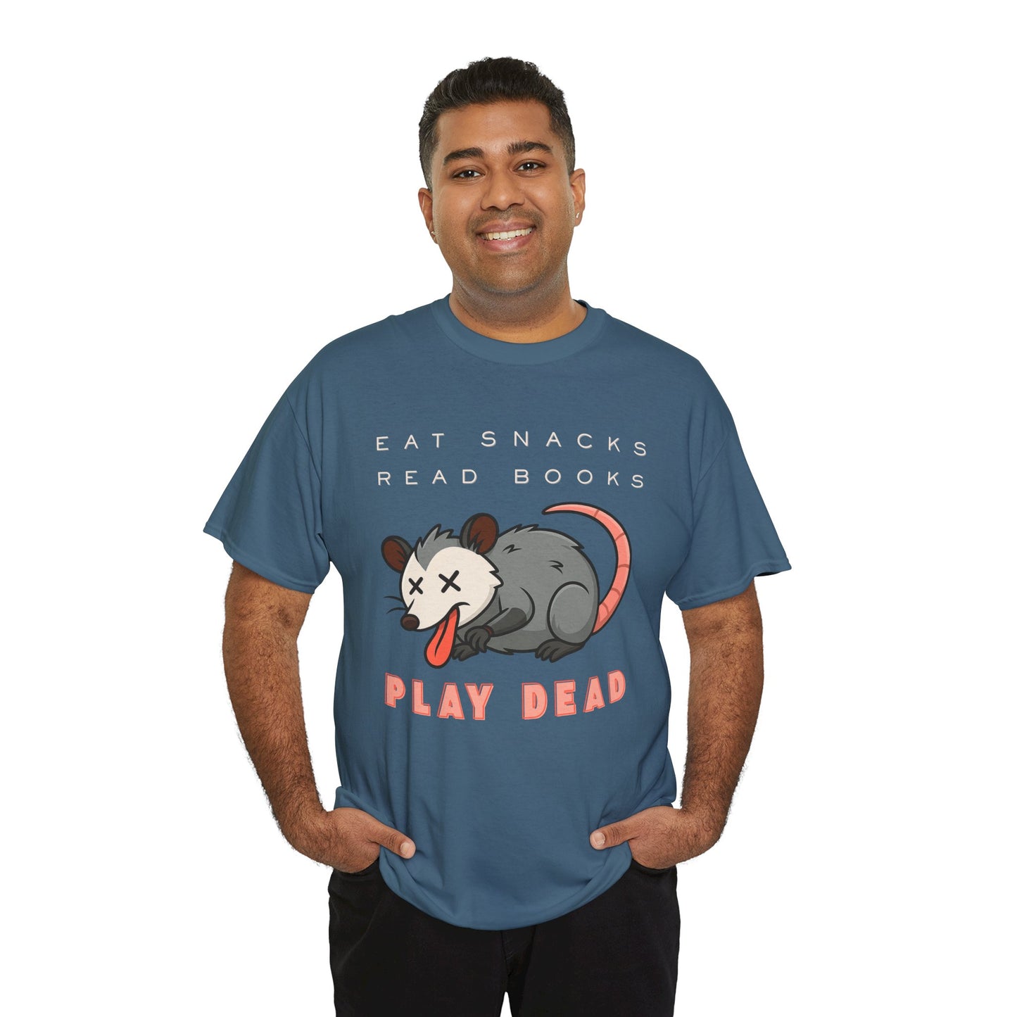 Man wearing a teal t-shirt with an opossum graphic and text 'Eat Snacks. Read Books. Play Dead.'