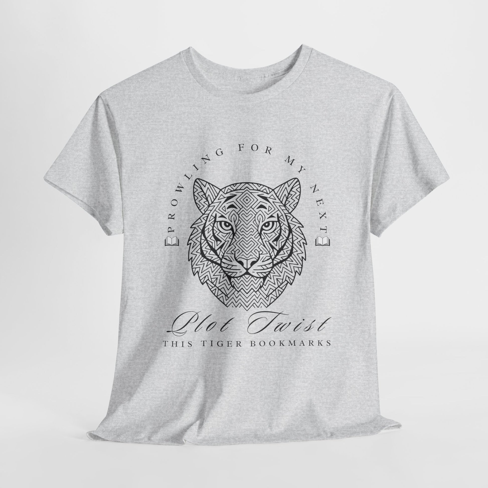 Gray t-shirt with a black geometric tiger design at the center, curved along the top with books at either end is text 'PROWLING FOR MY NEXT', below the tier are the words 'PLOT TWIST - This Tiger Bookmarks'