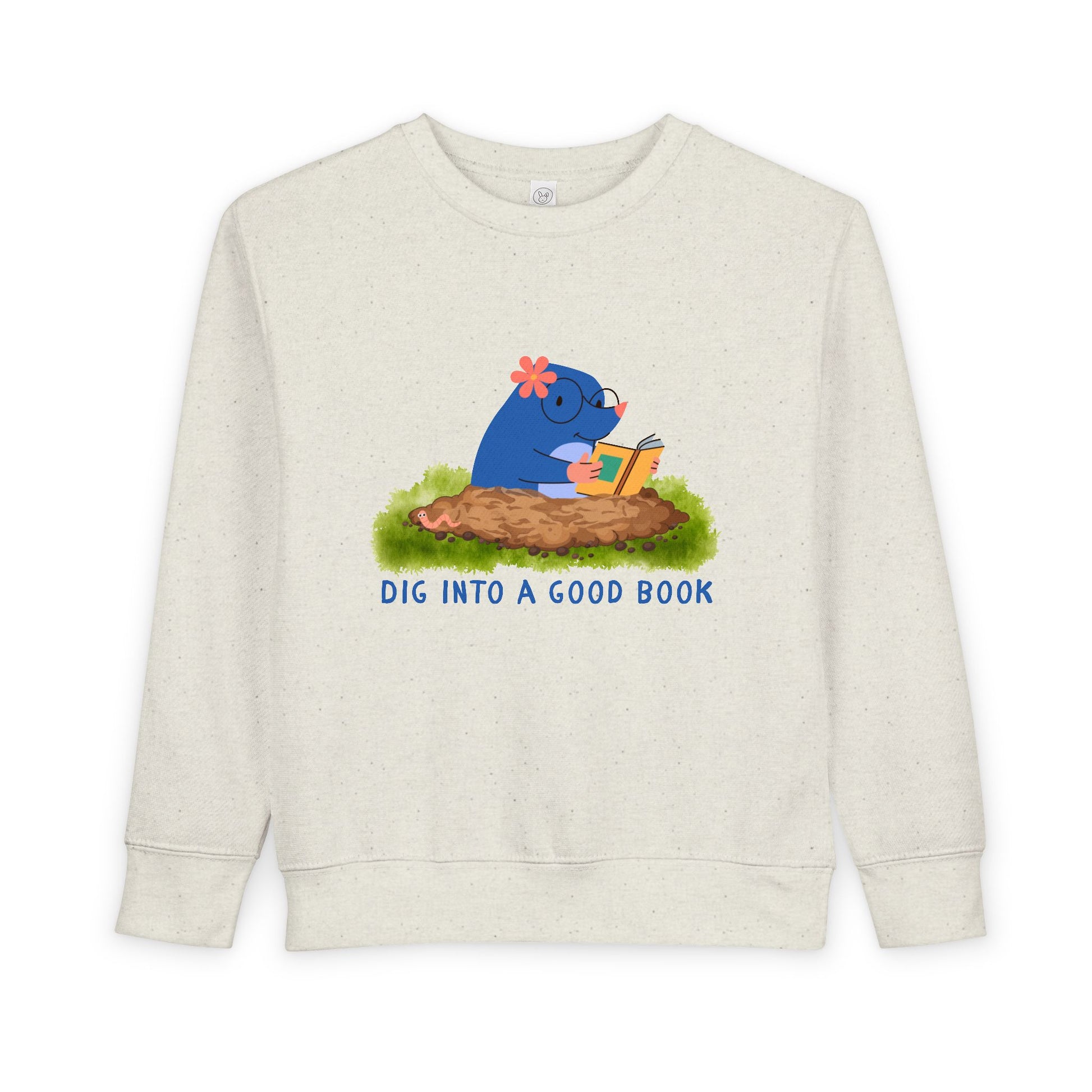 Beige toddler sweatshirt with a graphic of a mole reading a book and text 'Dig into a good book' 