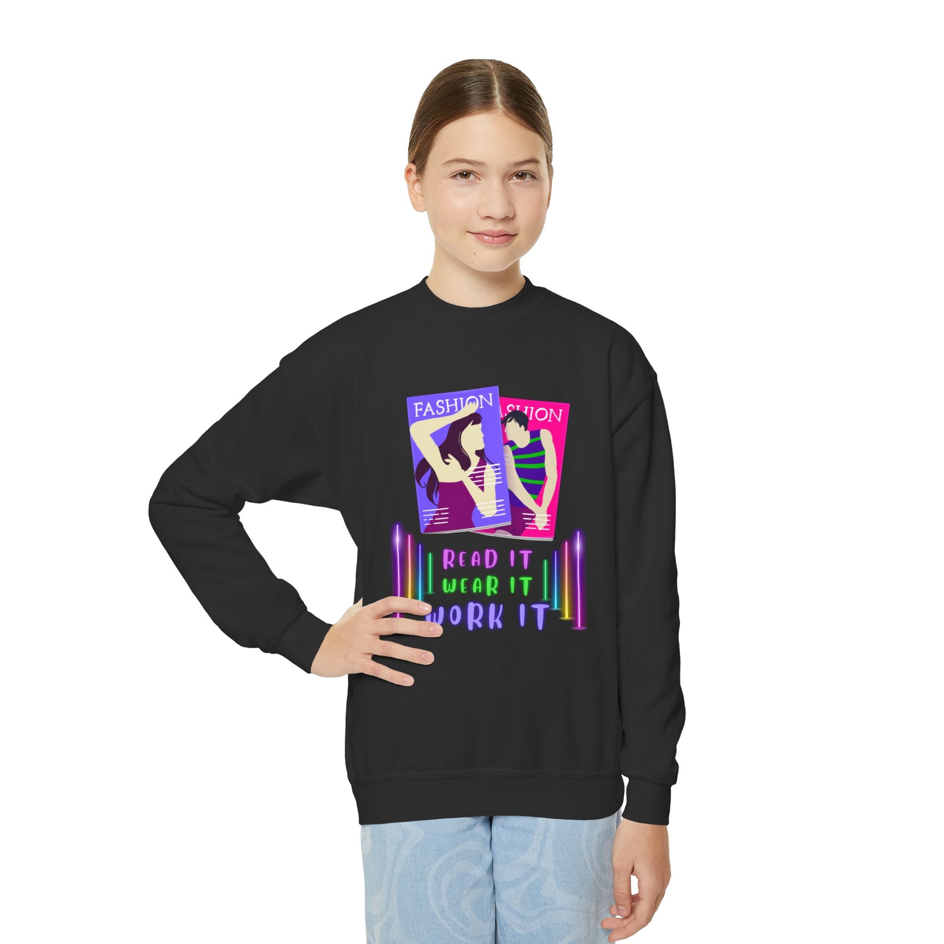 Girl wearing a black sweatshirt with colorful fashion magazine, neon lights and text 'Read It. Wear It. Work It.' 