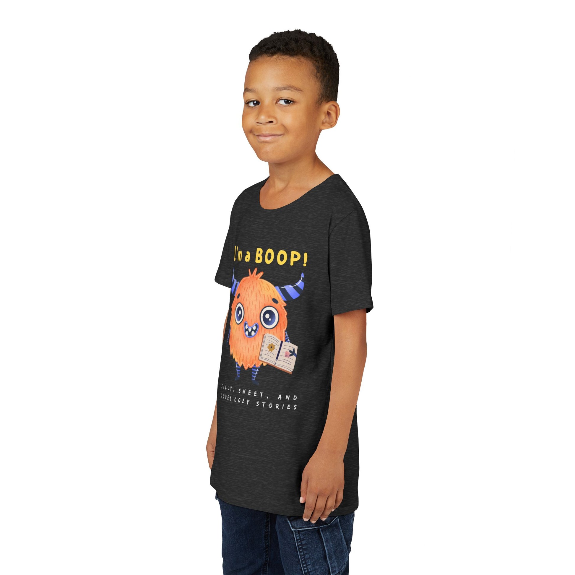 Boy wearing a dark t-shirt with a cartoon monster and text 'I'm a BOOP!'
