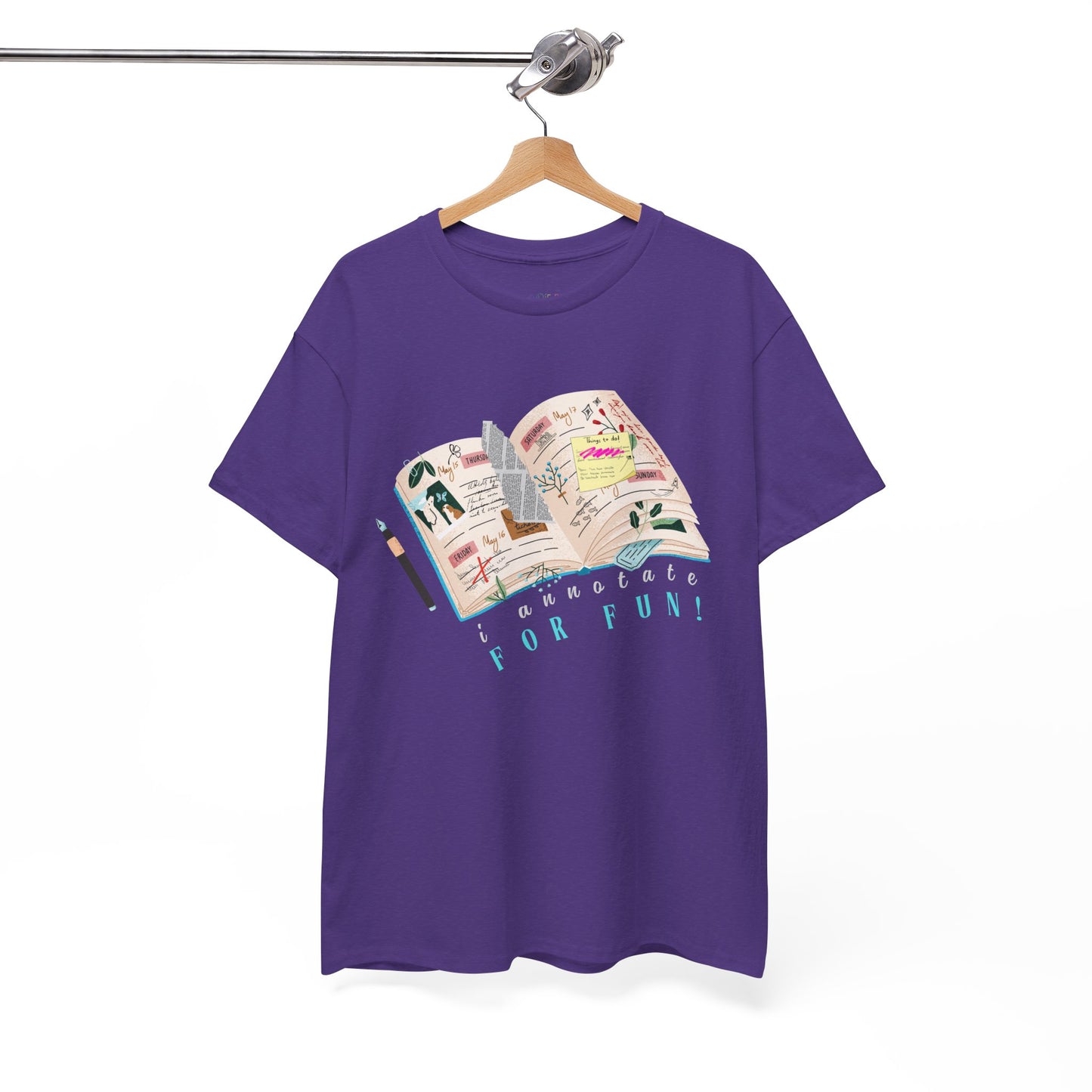 Purple t-shirt with a An open scrapbook full of scribbles, tickets, newspaper clippings and more, text 'I Annotate For Fun' 