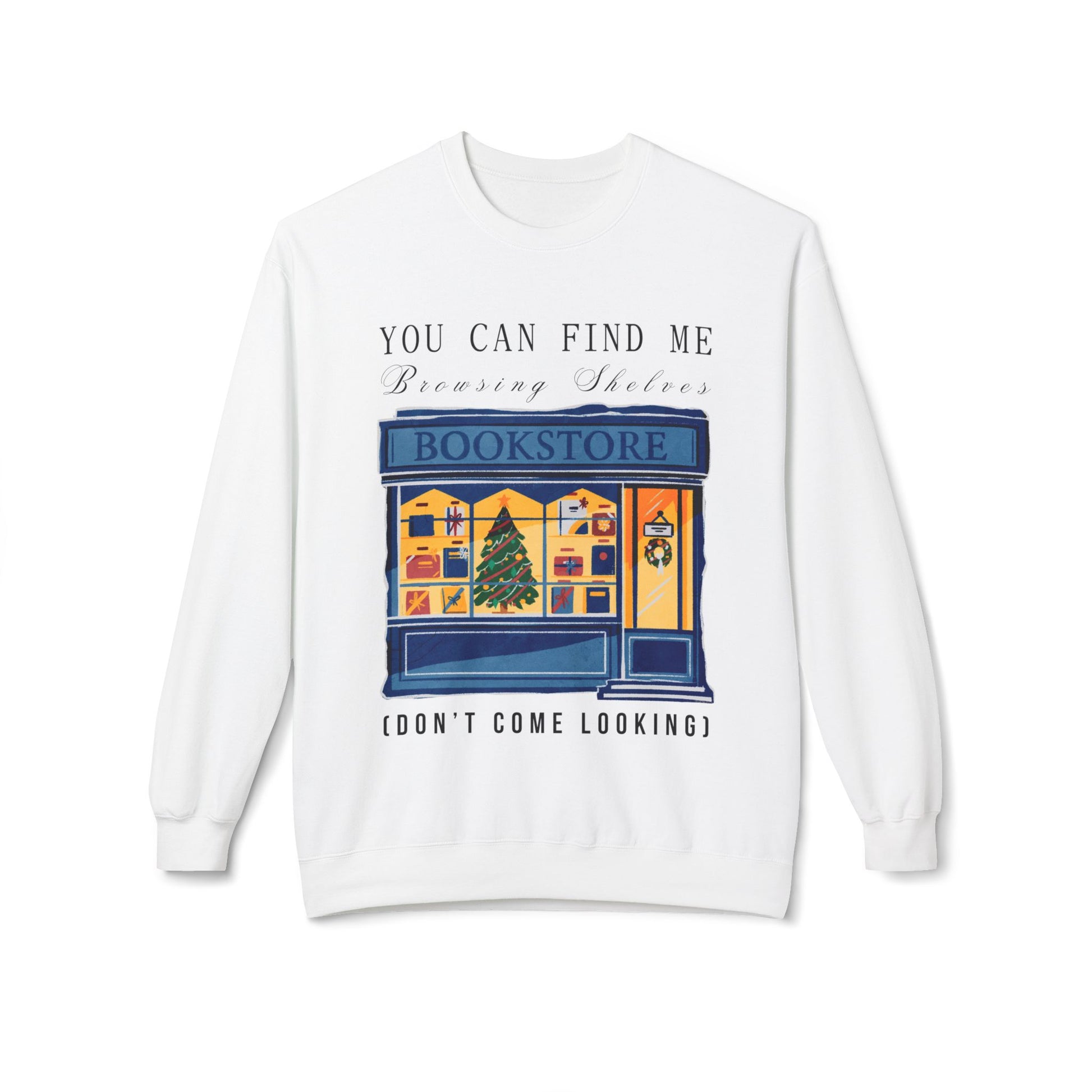 White sweatshirt with a graphic of a bookstore, Christmas tree in the window and text 'You Can Find Me Browsing Shelves (Don't Come Looking)'
