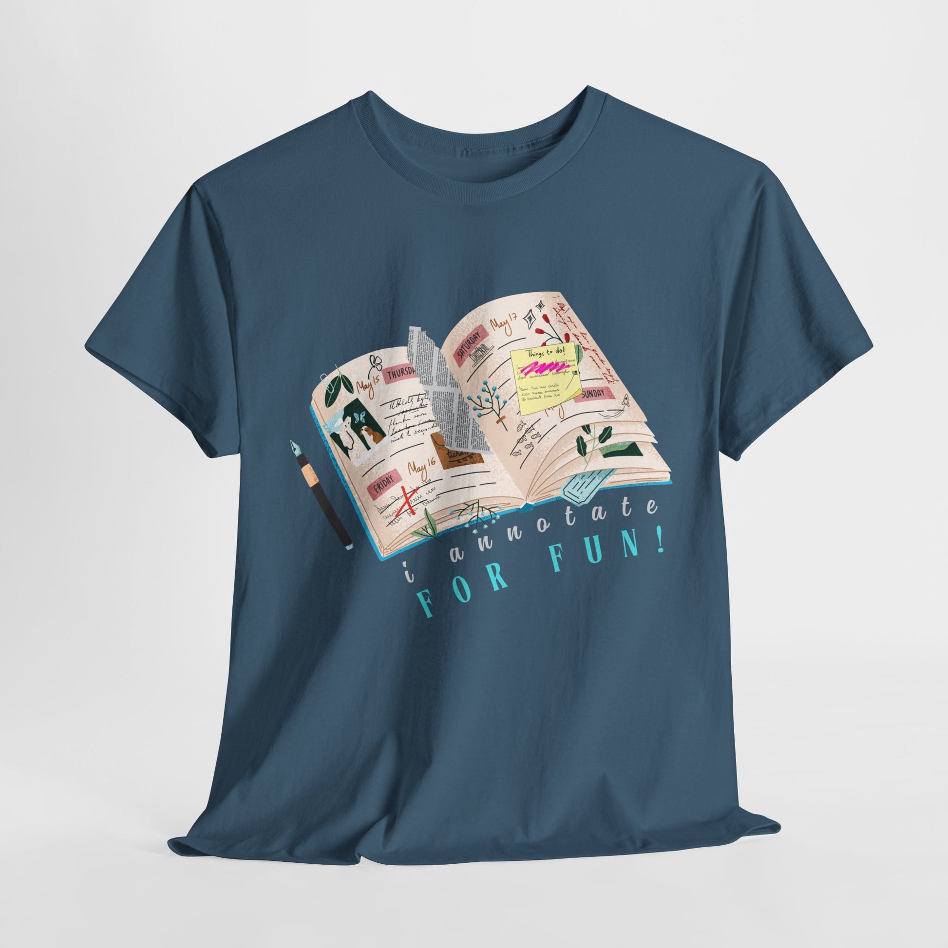 Blue t-shirt with a wonderful open book graphic full of scribbles, post its, torn newspaper, pressed flowers, tickets and text 'I Annotate For FUN!'