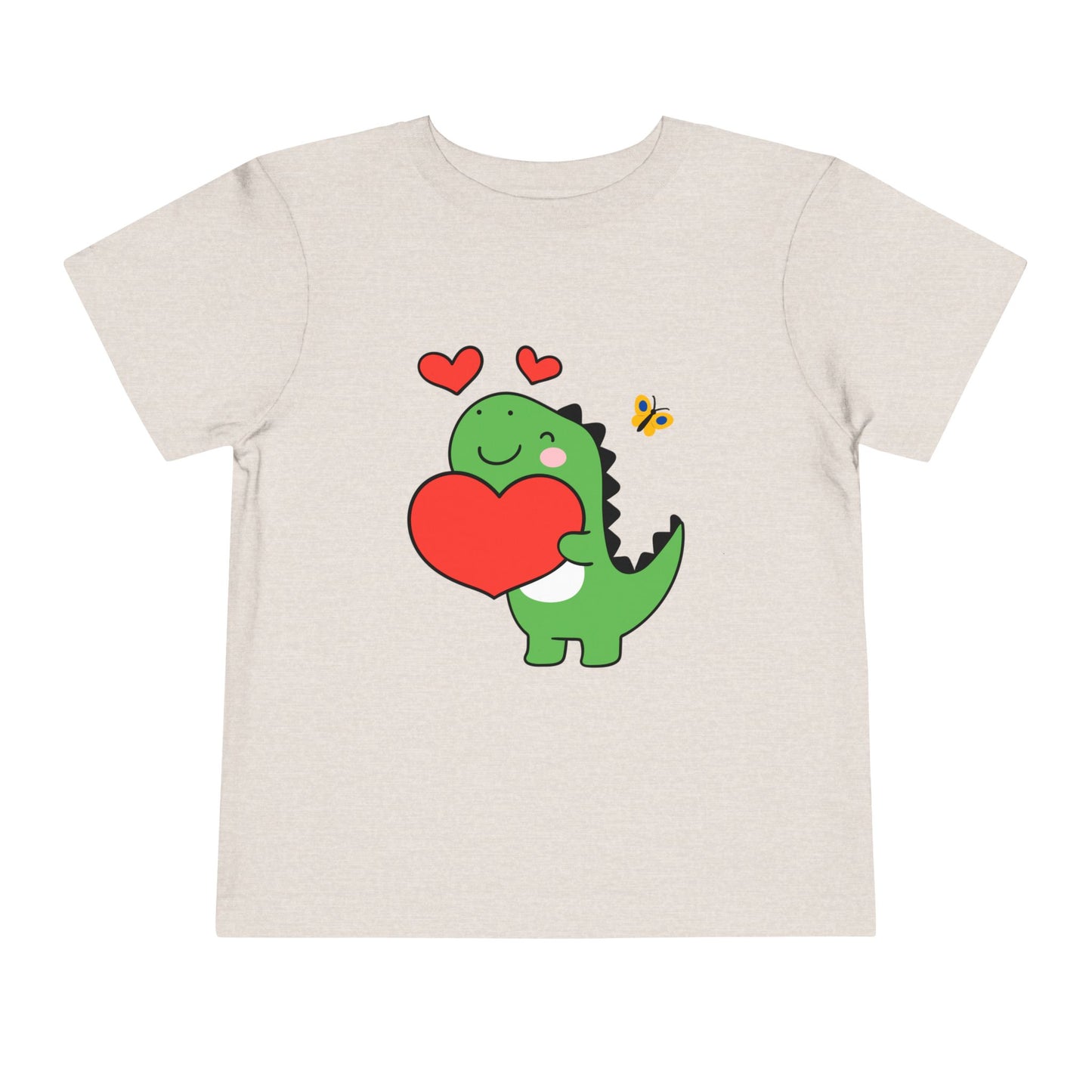 Beige toddler t-shirt with a cartoon dinosaur hugging a red heart