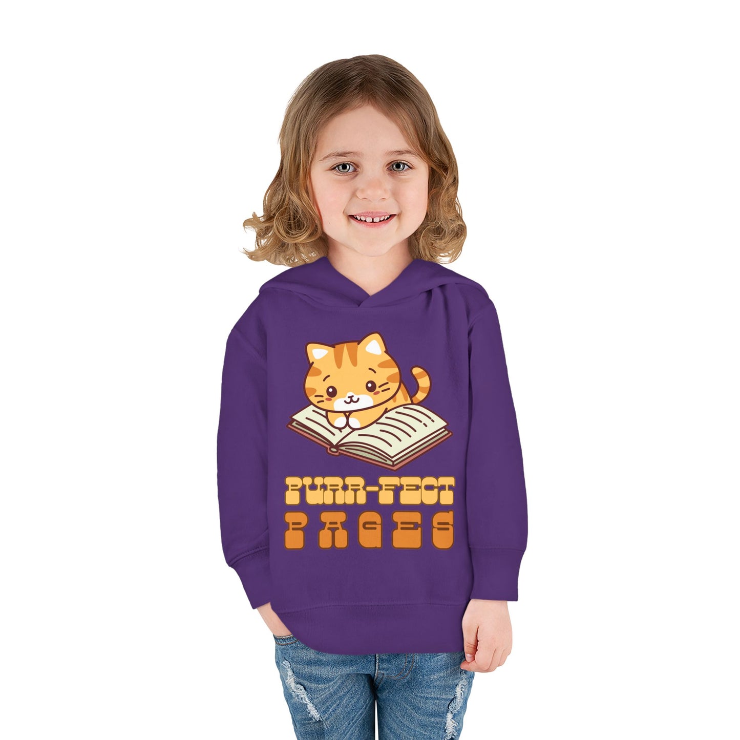 Girl wearing a purple toddler hoodie with a cat graphic laying on a book and retro text 'Purr-fect Pages' 