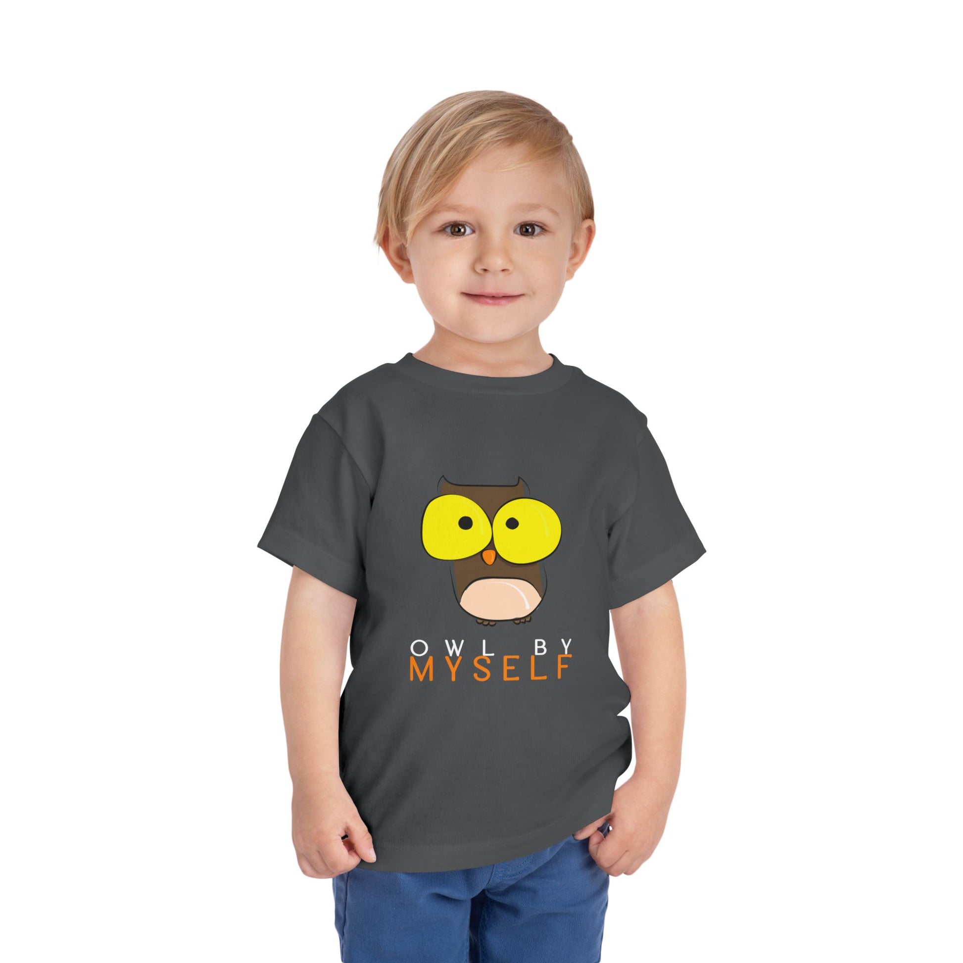 Child wearing a gray toddler t-shirt with an big eyed owl graphic and 'Owl by Myself' text 