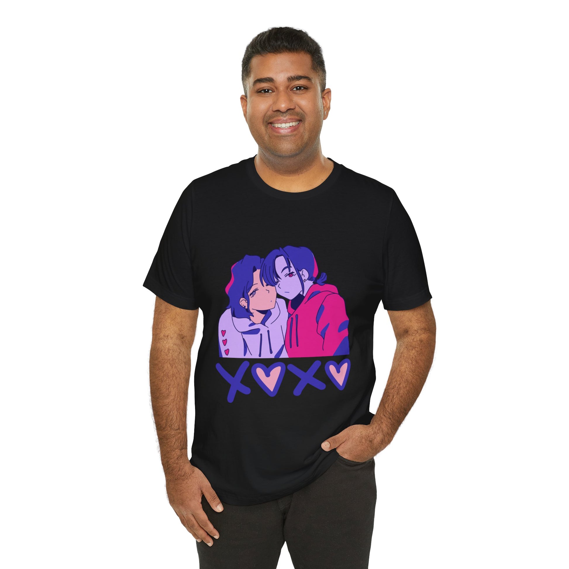 Man wearing a black t-shirt with an anime pink, purple and blue graphic design of two people leaning in together above a row of XOXO (O's in the shape of hearts)