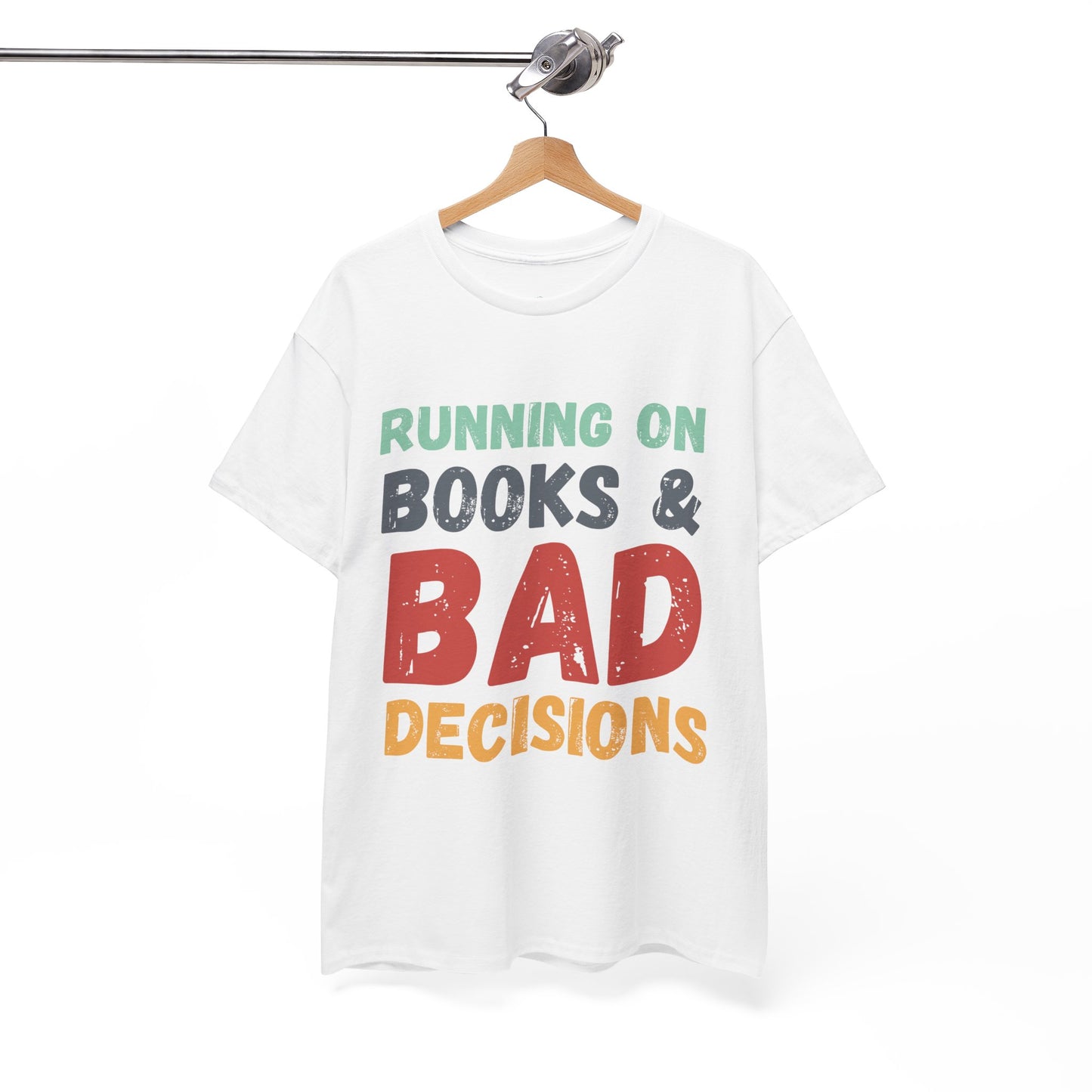 White t-shirt with colorful retro text 'Running on Books & Bad Decisions' 