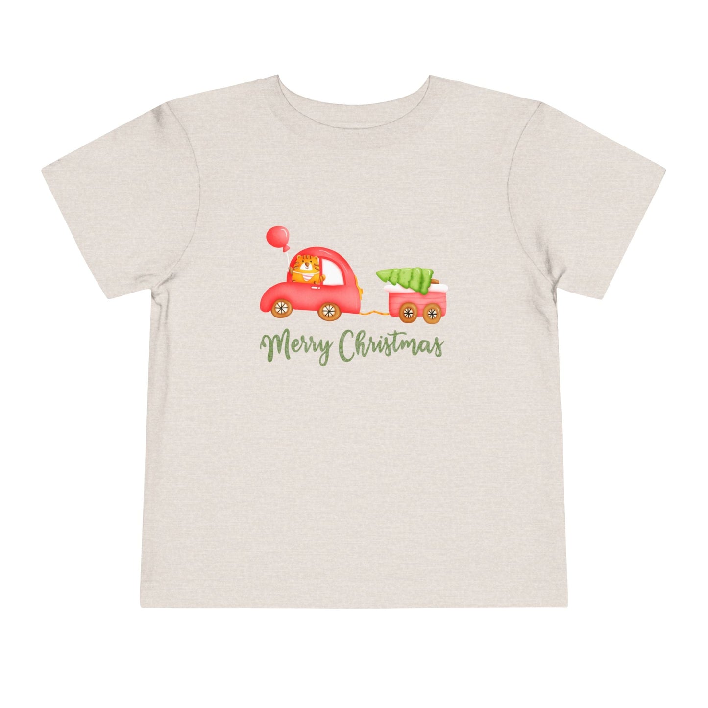 Tan/gray toddler t-shirt with a tiger driving a red car, pulling a tailer with a Christmas tree and text 'Merry Christmas' on a white background