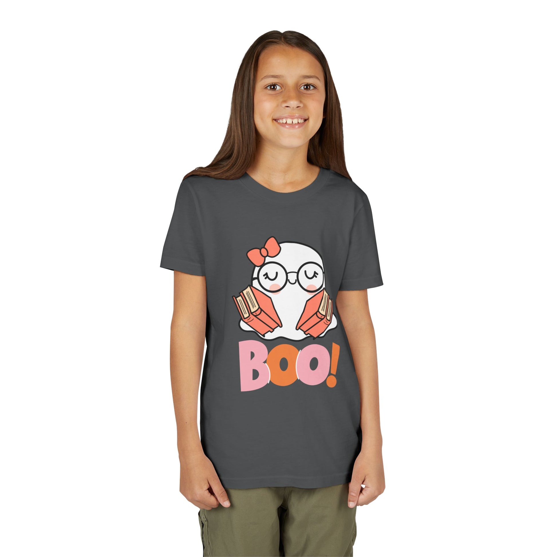 Girl wearing a gray t-shirt with an eyeglass wearing ghost holding two armfuls of books and 'BOO!' text