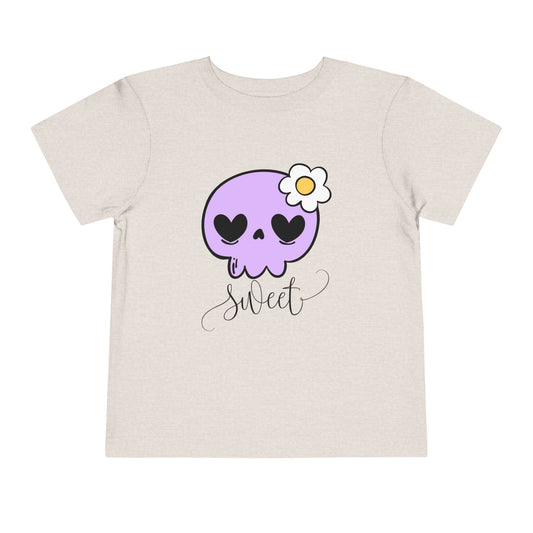 Tan toddler t-shirt with a purple skull design and the word 'sweet' 