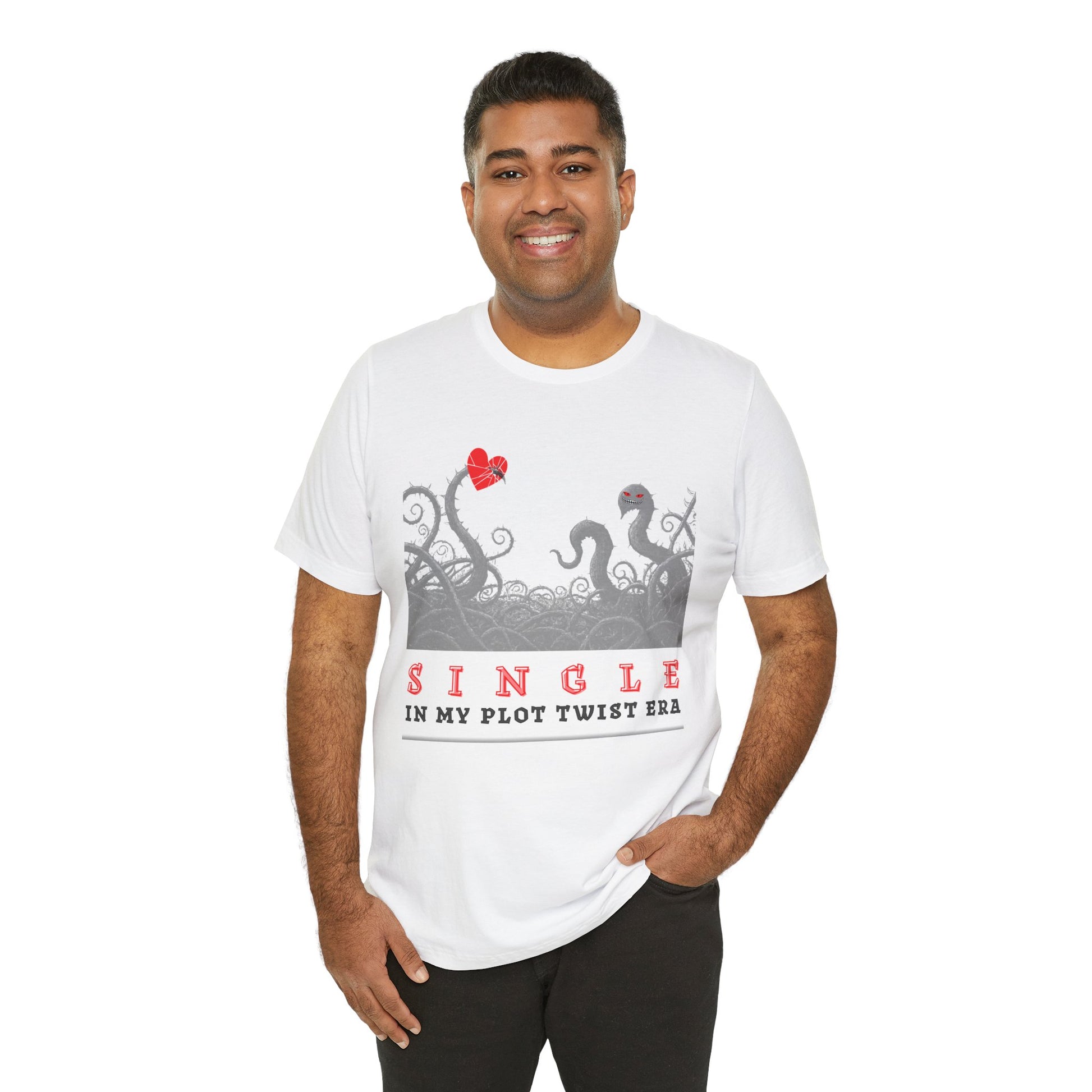 Man wearing a white t-shirt with thorny vines stabbed through a heart and text 'SINGLE. In My Plot Era' 