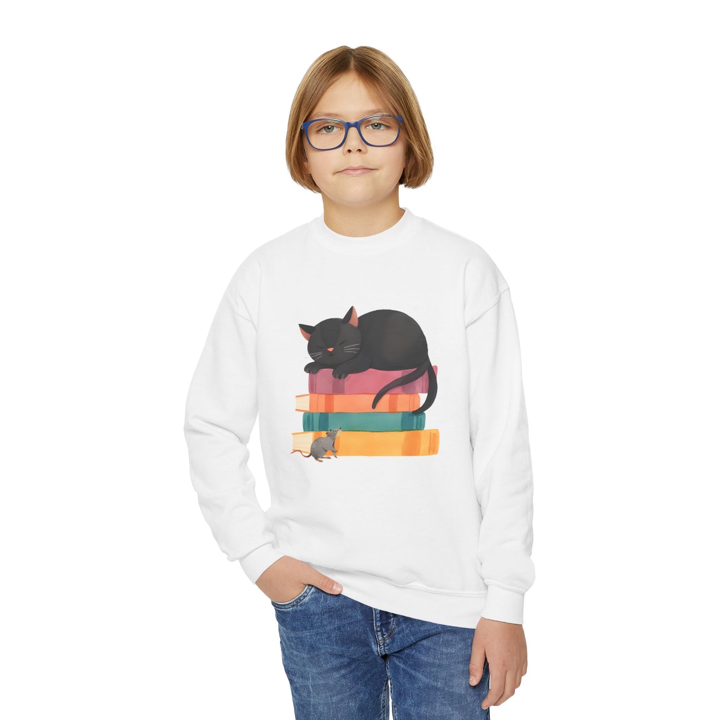 Boy wearing a white sweatshirt with a black cat and sleeping on a stack of books