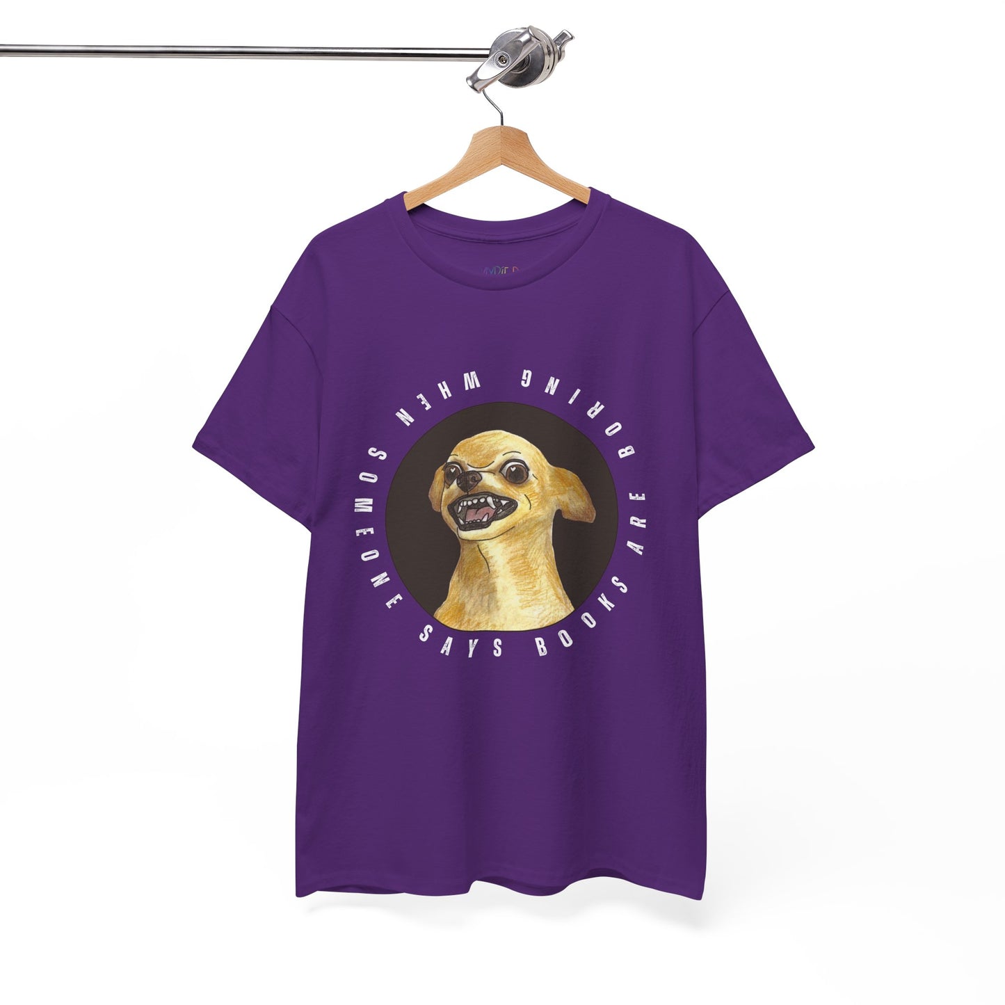 Purple t-shirt with a graphic of a fierce chihuahua dog, circled by text 'When Someone Says Books Are Boring'