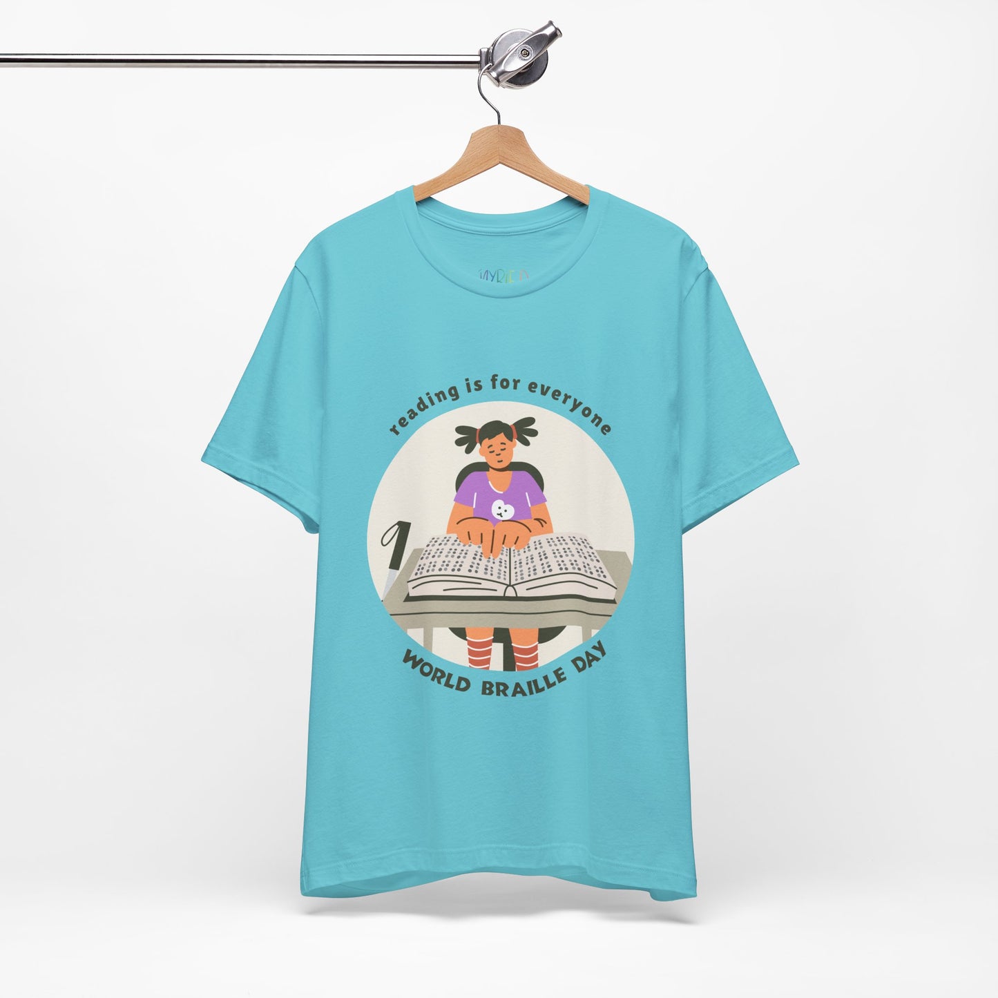 Turquoise t-shirt with a girl reading a book in braille and text circling that says 'Reading Is For Everyone, World Braille Day' 