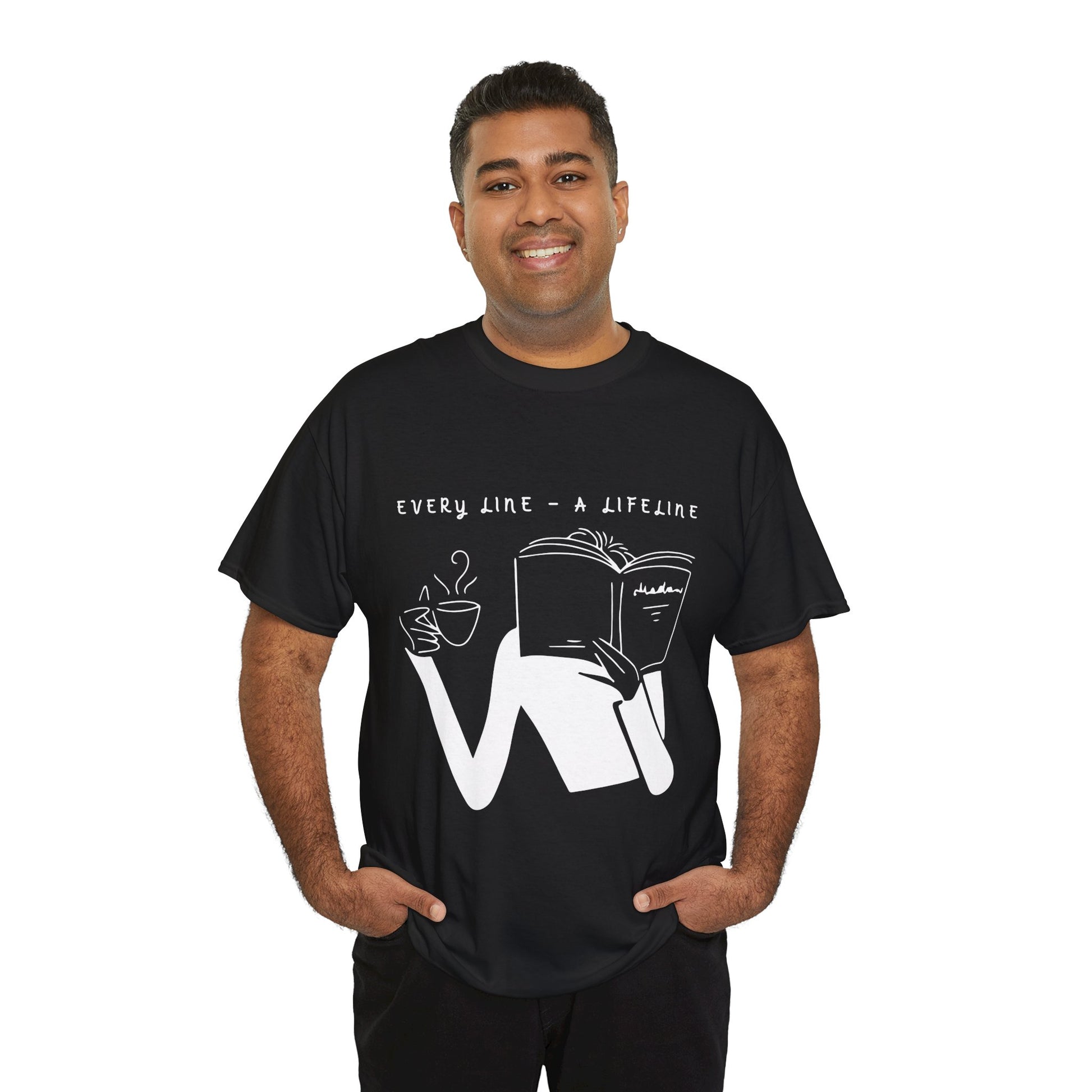 Man wearing a black t-shirt with white graphics of someone holding up a hot beverage and a book as they read, text 'Every Line - A Lifeline' 
