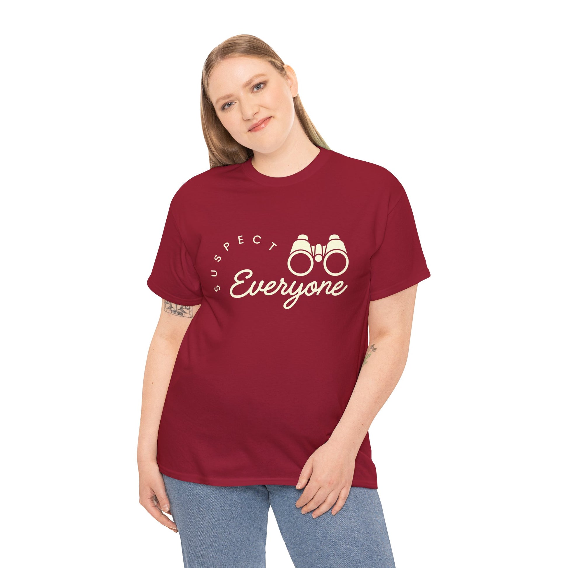 Woman wearing a red t-shirt with 'Suspect Everyone' text and binoculars graphic 