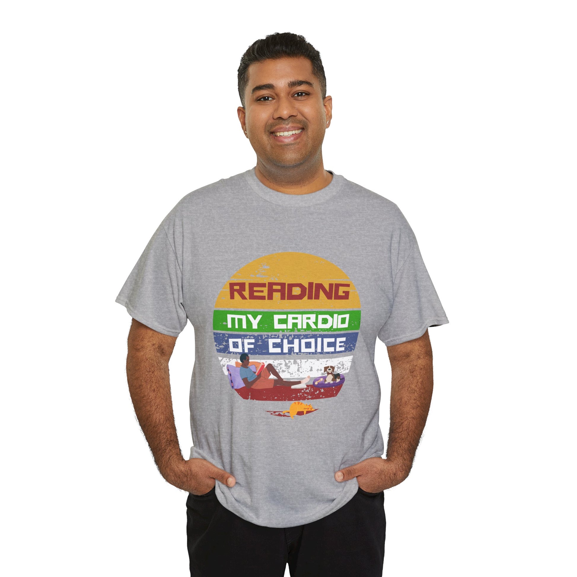 Man wearing a gray retro t-shirt with a colorful striped circle featuring a man reading a book alongside his dog and cat, and text 'Reading, My Cardio Of Choice' 
