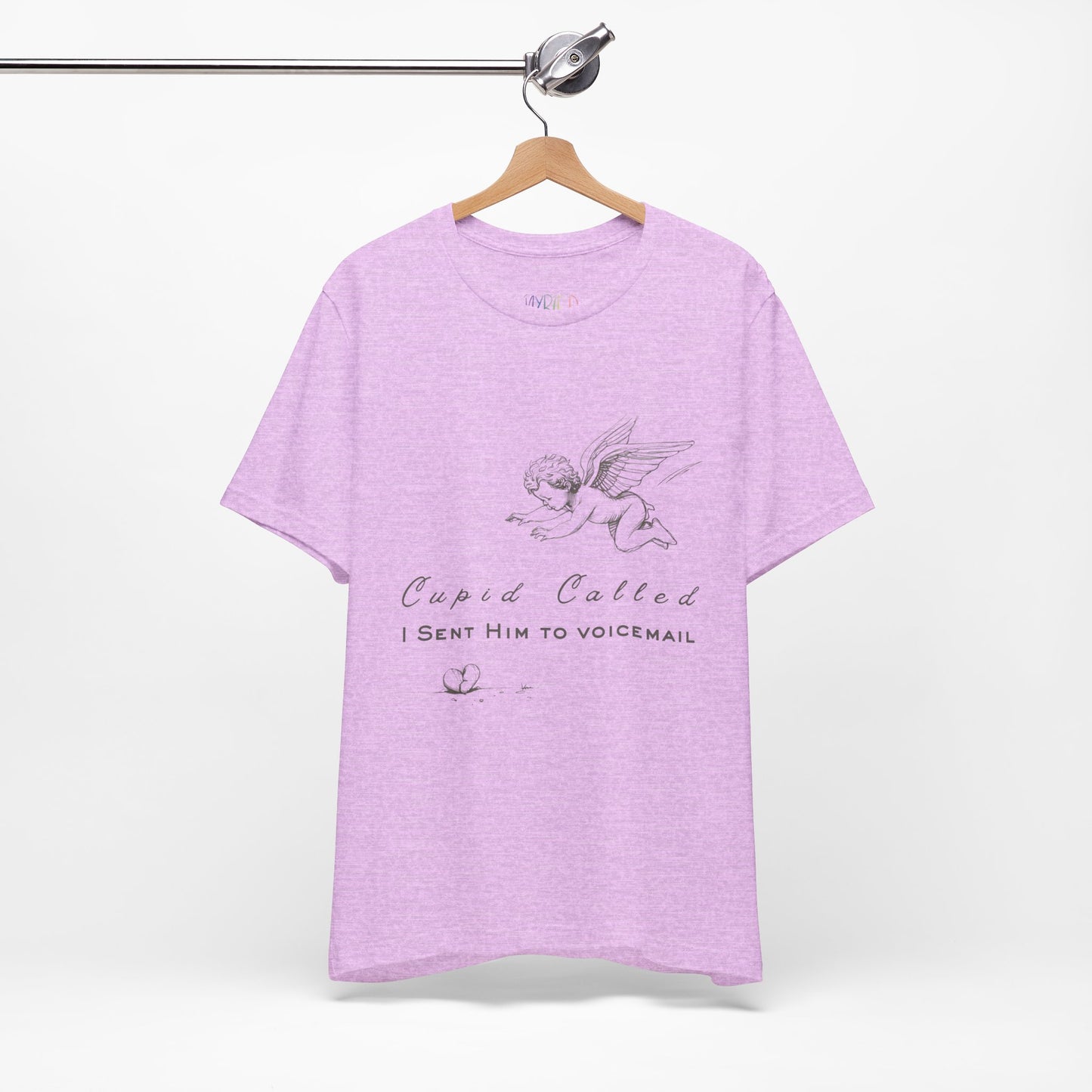 Light purple t-shirt with cupid graphic design, a broken heart on the floor and text 'Cupid Called. I Sent Him To Voicemail.'