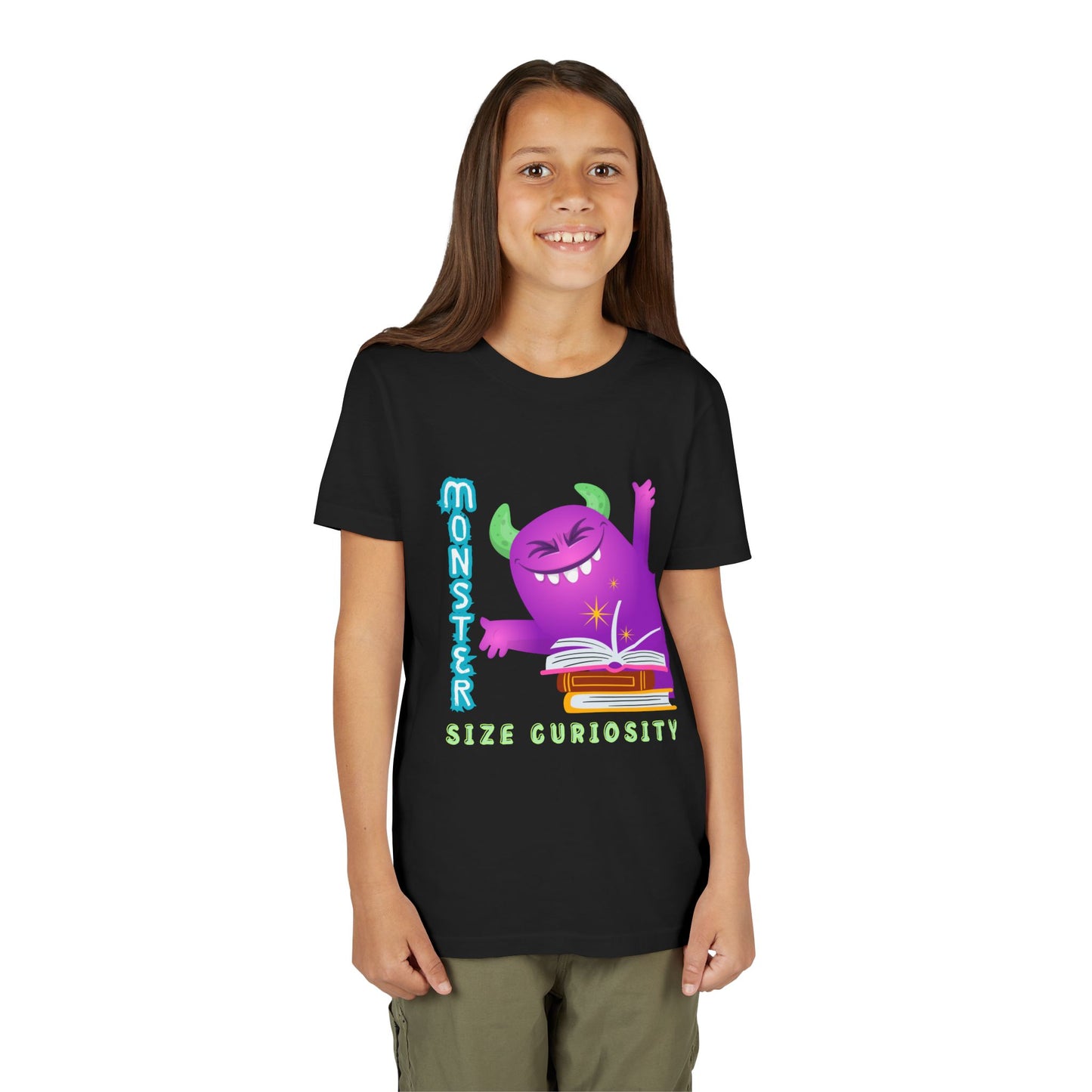 Girl wearing a black t-shirt with a purple monster leaning in from the edge of the page, a stack of books and text 'Monster Size Curiosity' 