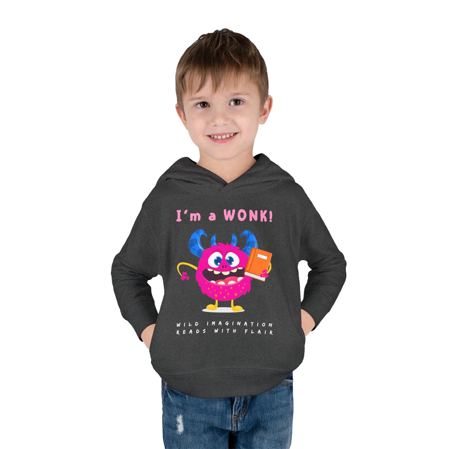 Boy wearing a dark gray toddler hoodie with a cartoon monster holding a book and text 'I'm a Wonk!'