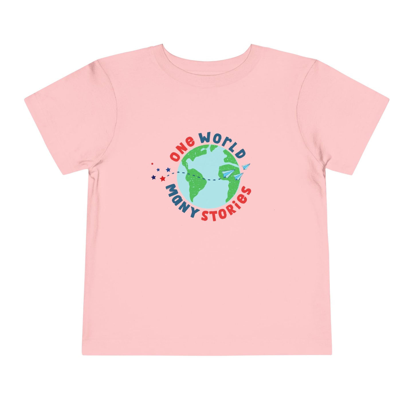 Pink t-shirt with a graphic of the Earth and 'One World, Many Stories' text 