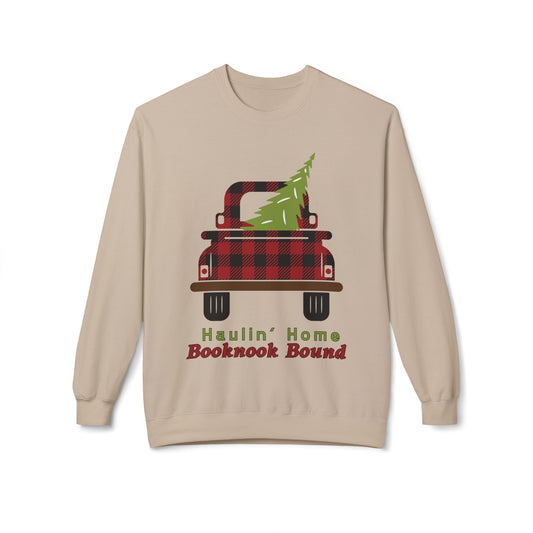 Beige sweatshirt of a red and black plaid truck with a Christmas tree in the bed and text "haulin' home booknook bound'