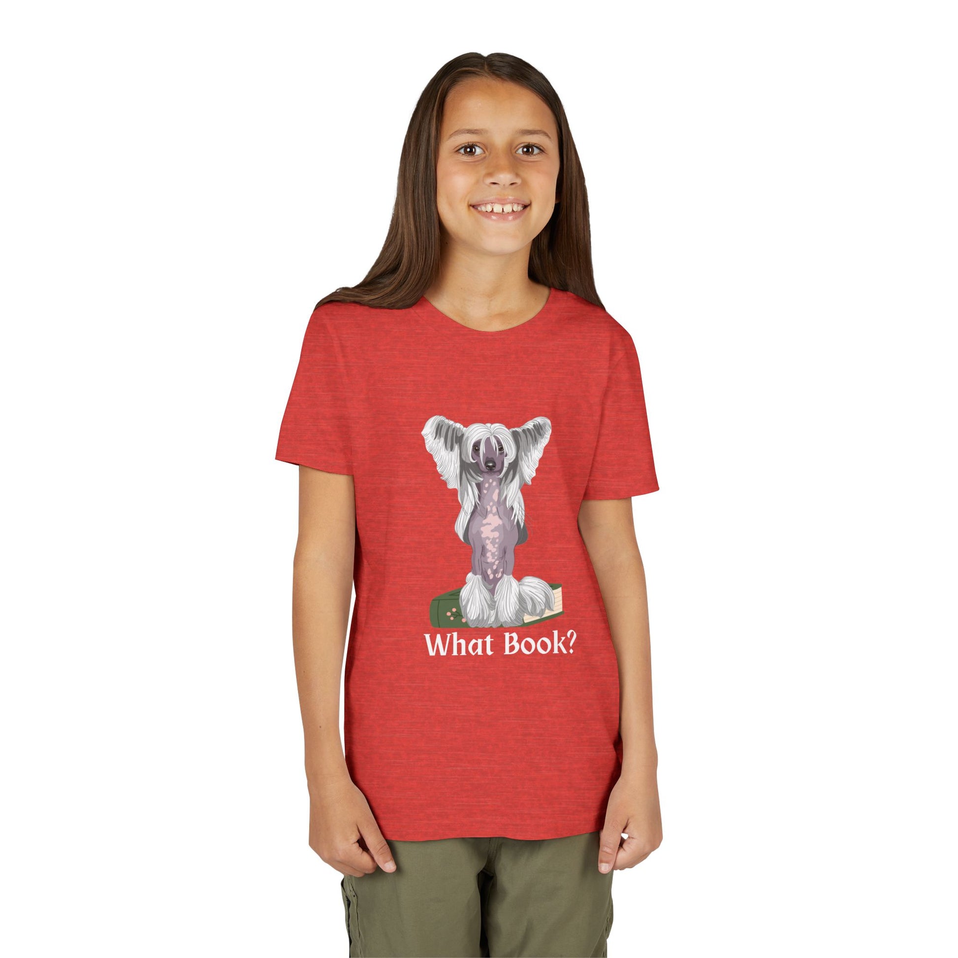 Girl wearing a red t-shirt with a graphic of a dog sitting on a book and text 'What Book?' 