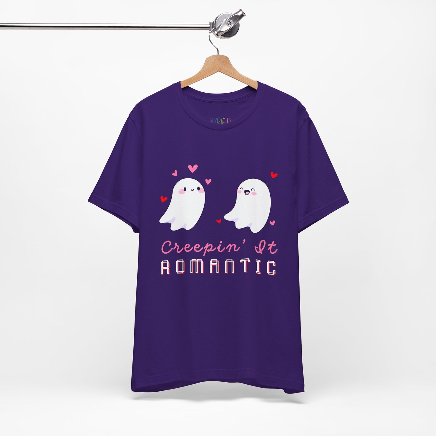 Purple t-shirt with two flirty ghosts, scattered hearts and text 'Creepin' It Romantic' 