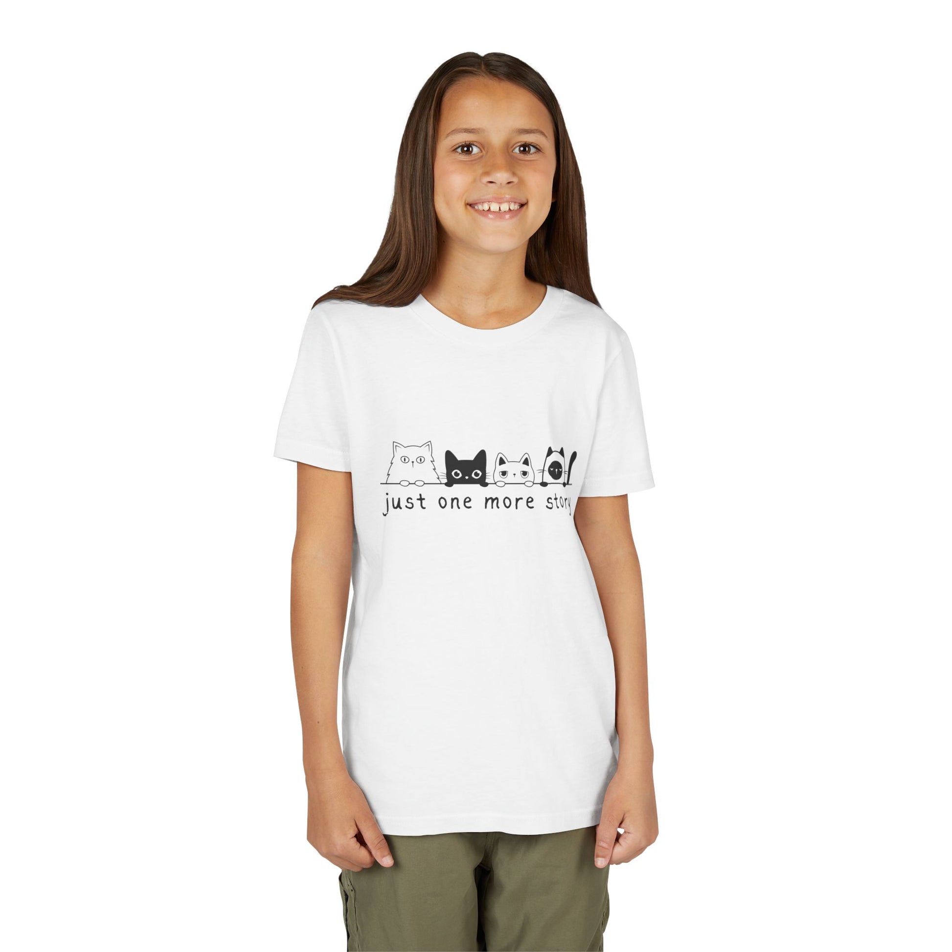 Girl wearing a white t-shirt with a row of cats peaking over a line and text 'just one more story'