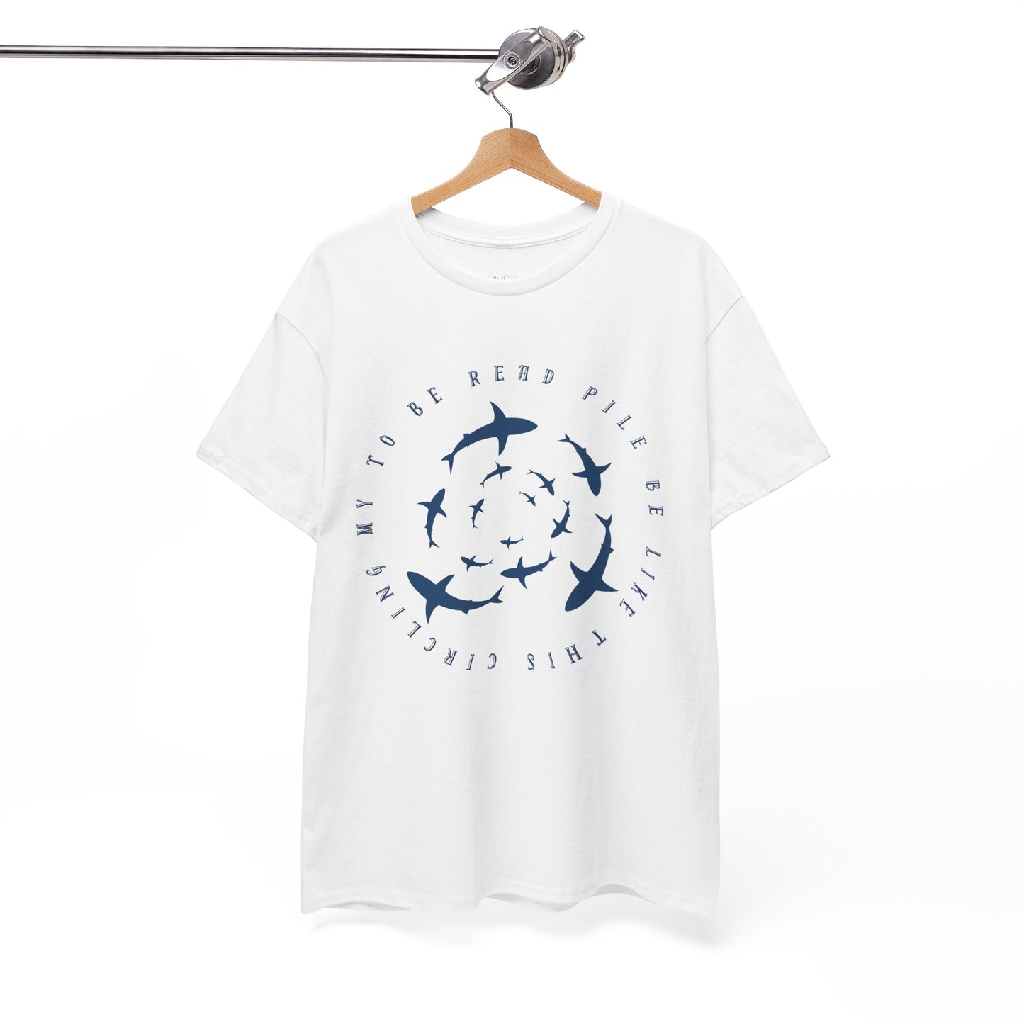 White t-shirt with white graphic sharks in various sizes circling and text 'circling my to be read pile be like this' 