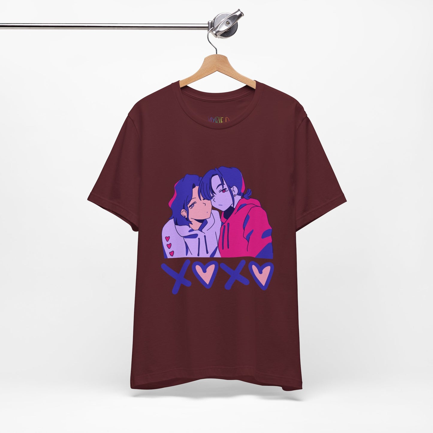 Maroon t-shirt with an anime pink, purple and blue graphic design of two people leaning in together above a row of XOXO (O's in the shape of hearts)