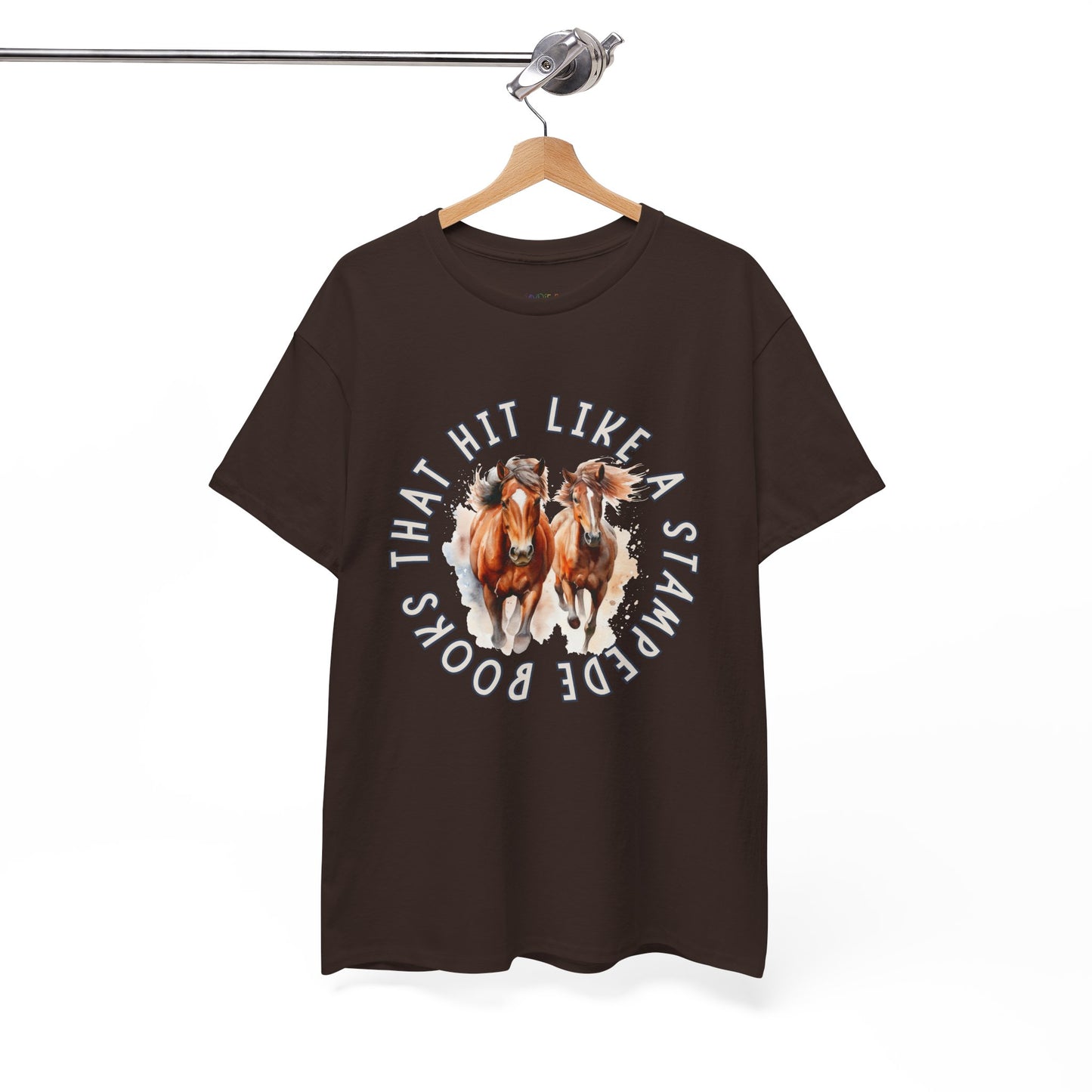 Brown t-shirt with horses running out from the center of the shirt and circled by words 'Books That Hit Like a Stampede' 