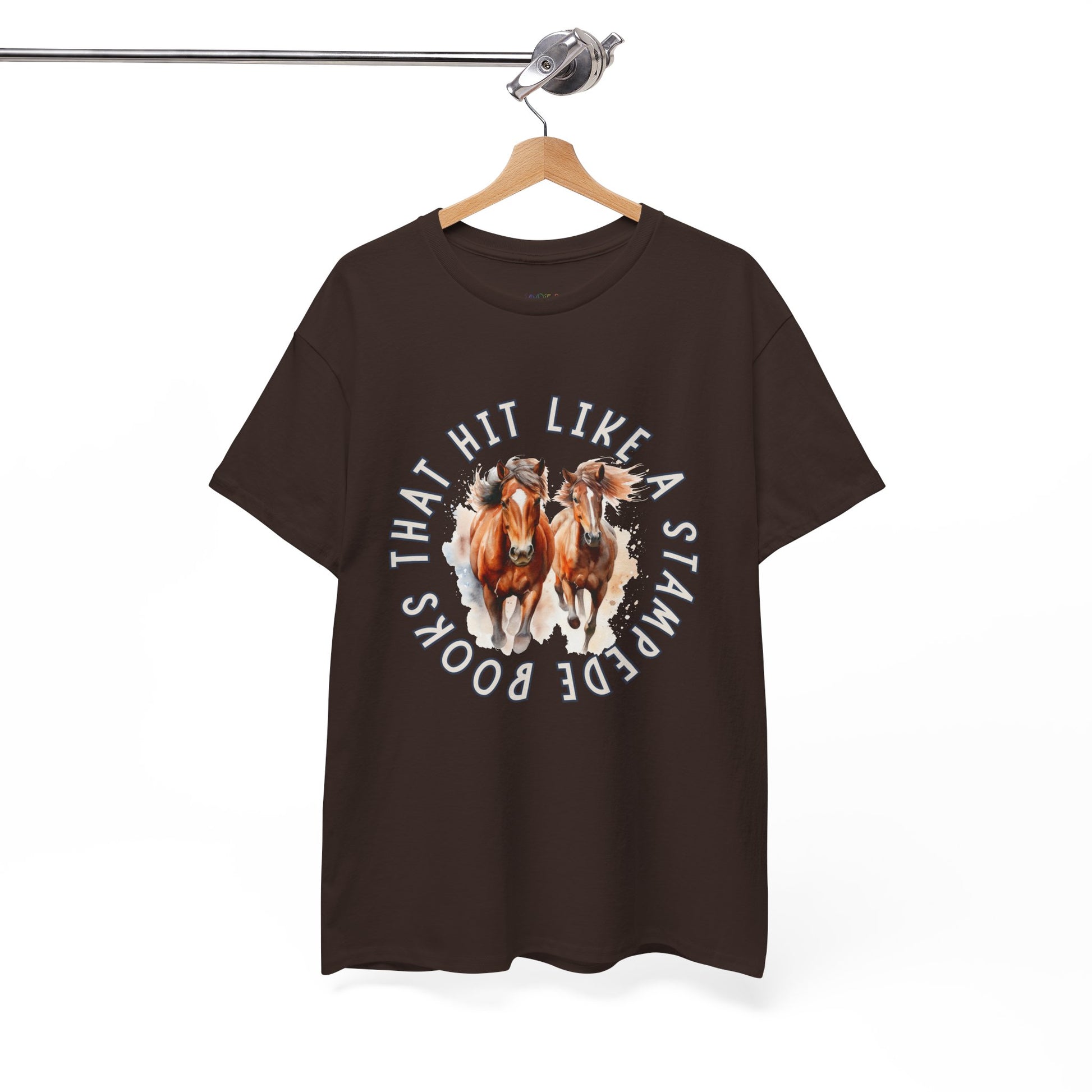 Brown t-shirt with horses running out from the center of the shirt and circled by words 'Books That Hit Like a Stampede' 
