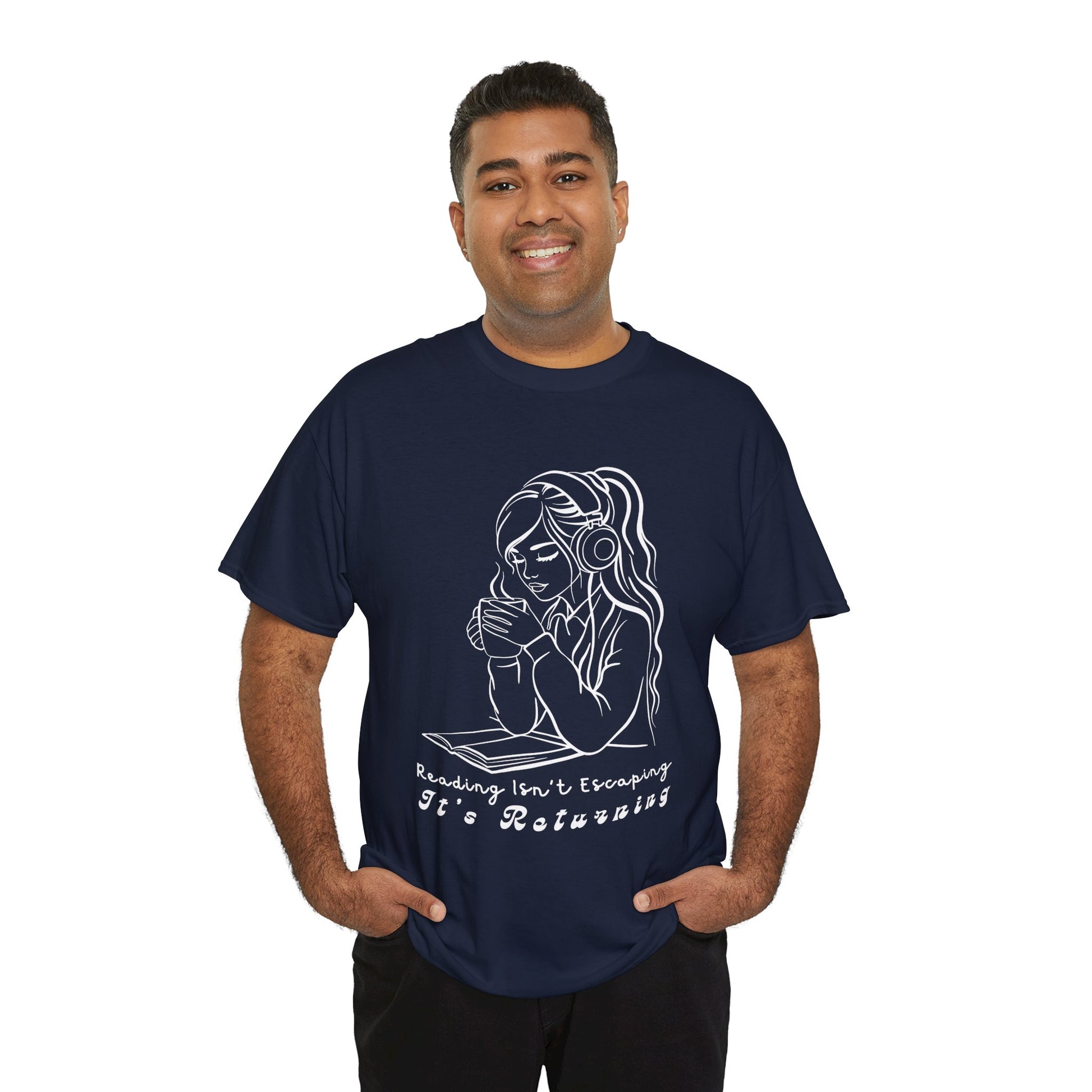Man wearing a navy blue t-shirt with a woman wearing headphones, cupping a hot beverage and reading a book, text 'Reading Isn't Escaping, It's Returning'