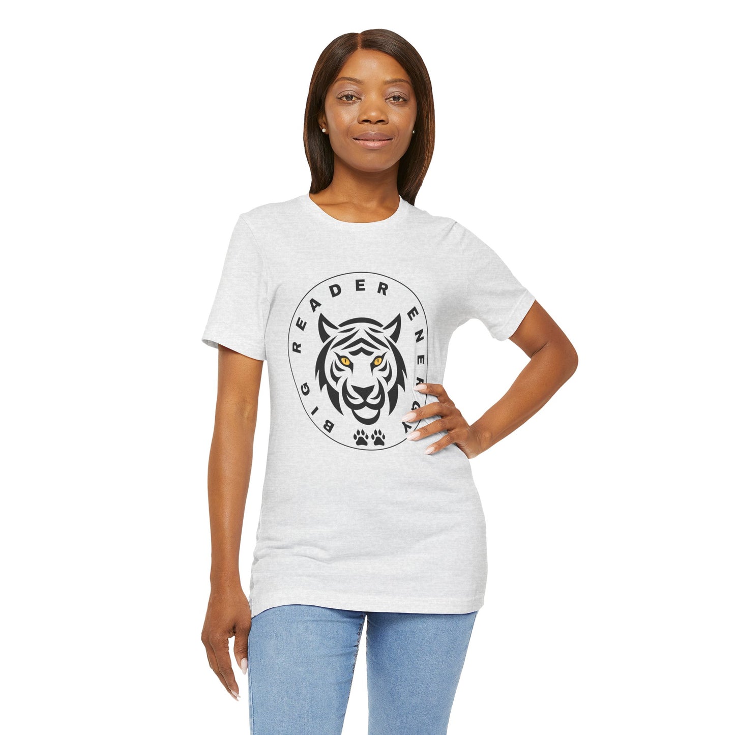 Woman wearing a light gray t-shirt with a black tiger logo, yellow eyes and circled by text 'Big Reader Energy'