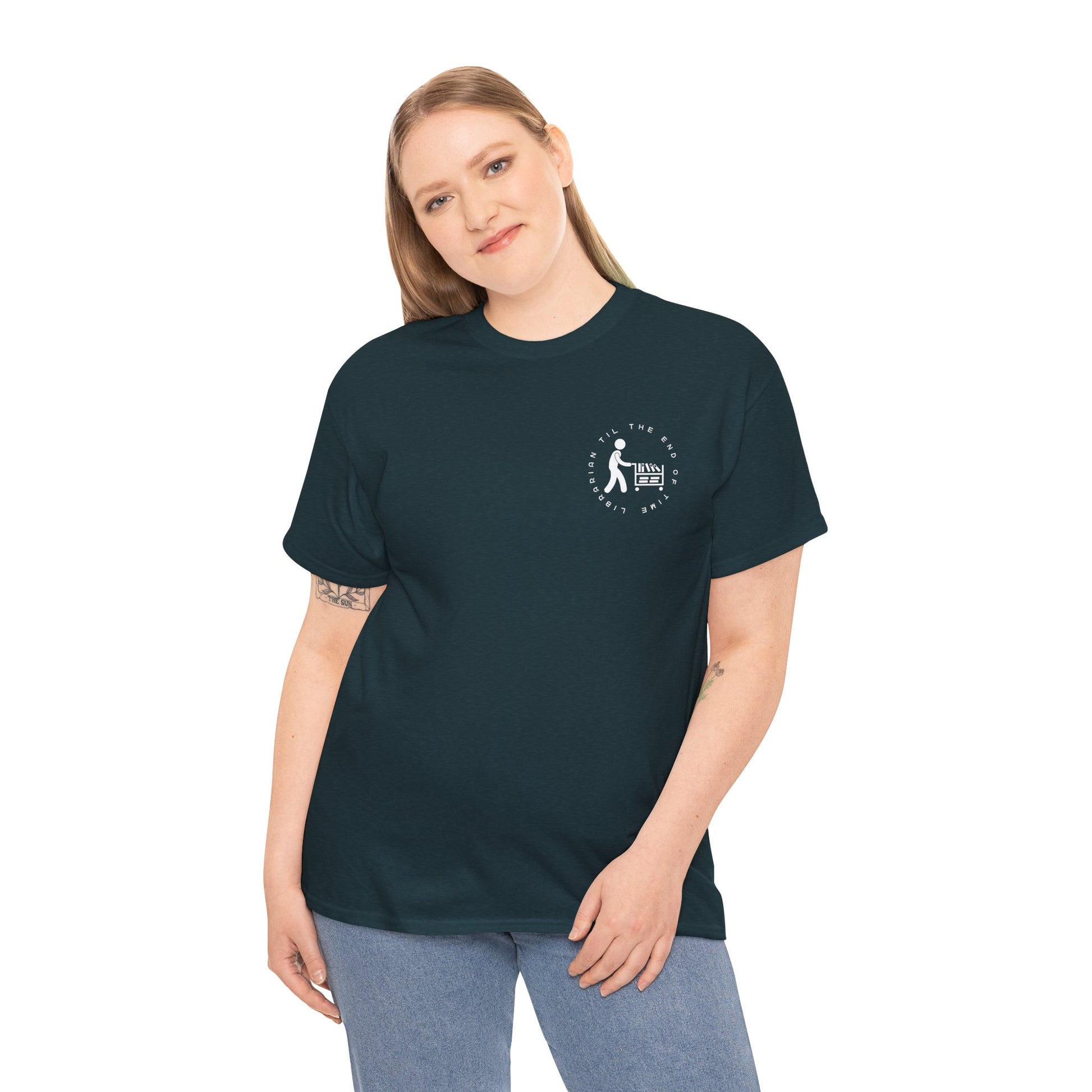 Woman wearing a midnight dual-sided t-shirt with a small librarian pushing a cart on the front and a full size bookshelf with a zombie hand reaching up on the back, text 'Late Fees Can't Stop Me'