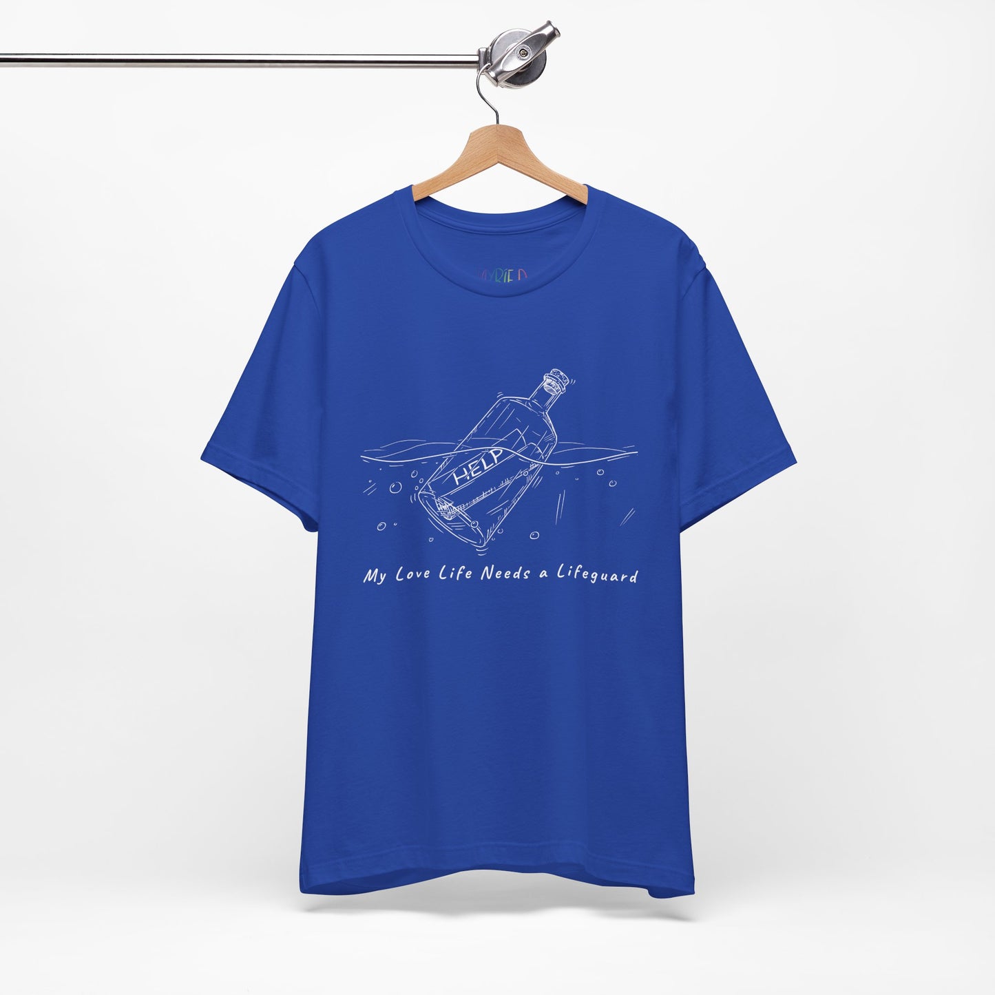 Blue t-shirt with white sketched image of a bottle floating in water with a rolled up paper inside that says 'help' and text below 'My Love Life Needs a Lifeguard'